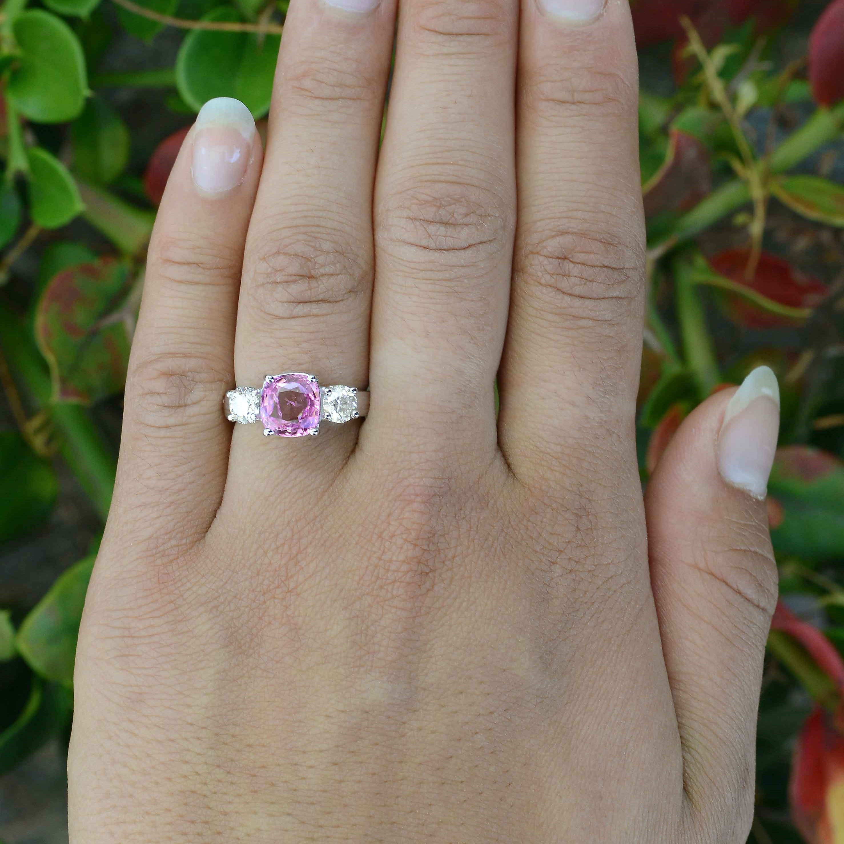 A GIA certified, near 3 carat natural purple pink sapphire with diamonds wedding ring.