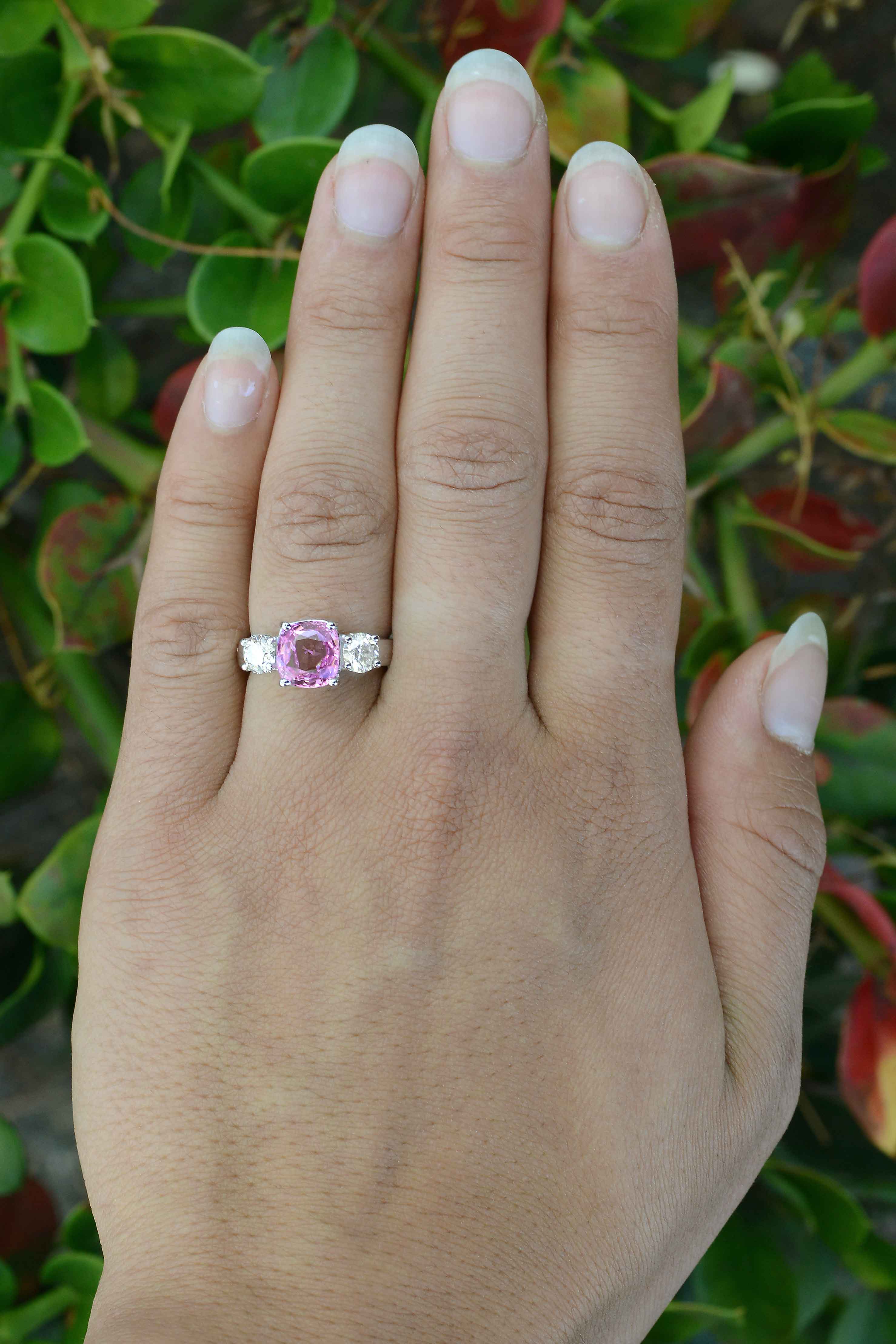 A GIA certified, near 3 carat natural purple pink sapphire with diamonds wedding ring.