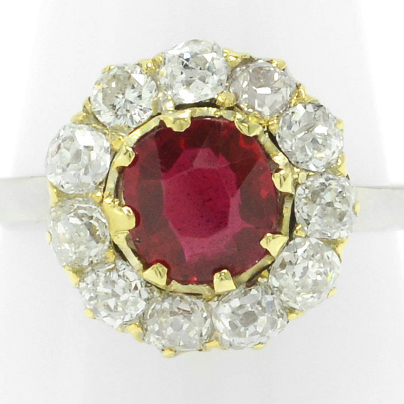 A unique 1 carat ruby engagement ring with over a half carat of old mine diamonds.