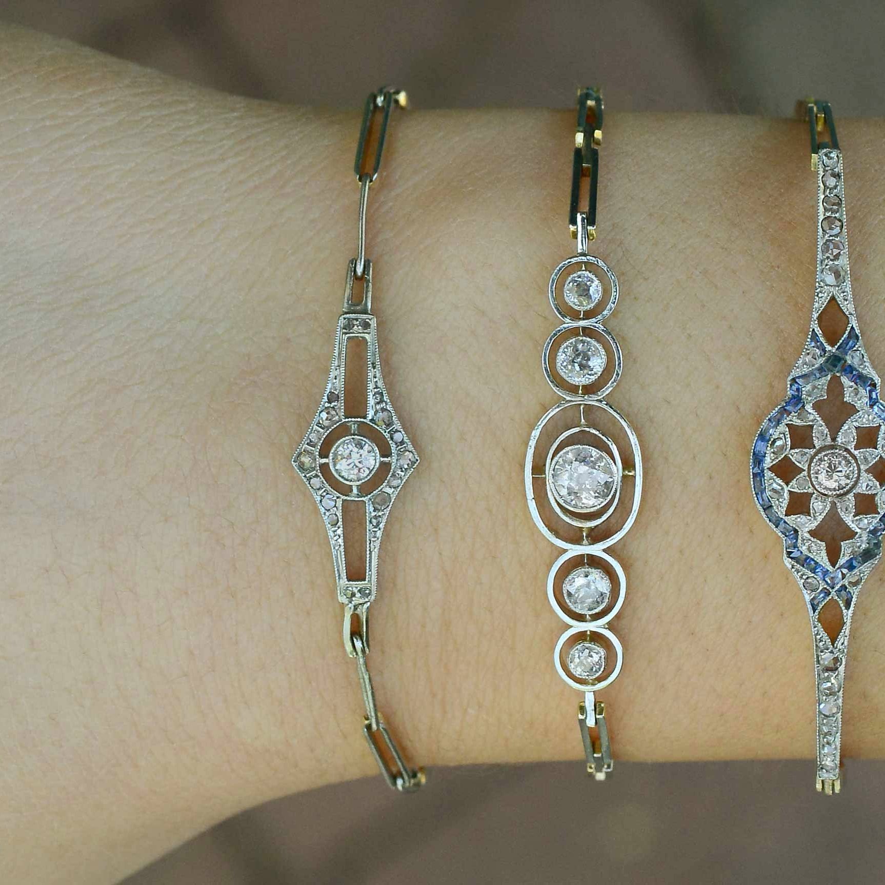 Here are some other antique diamond cluster tennis bracelets in stock.