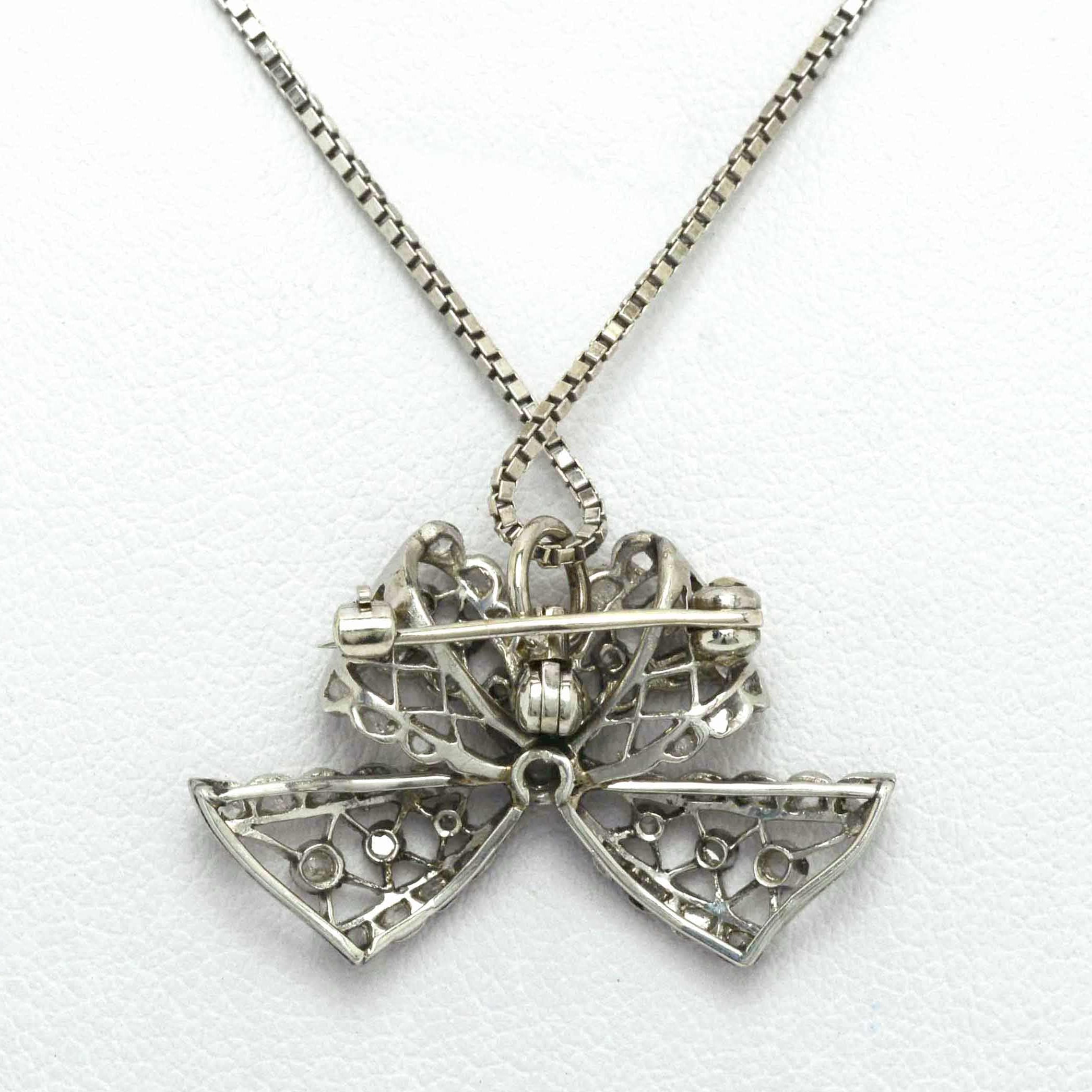 The back side of an antique Edwardian ribbon pendant.