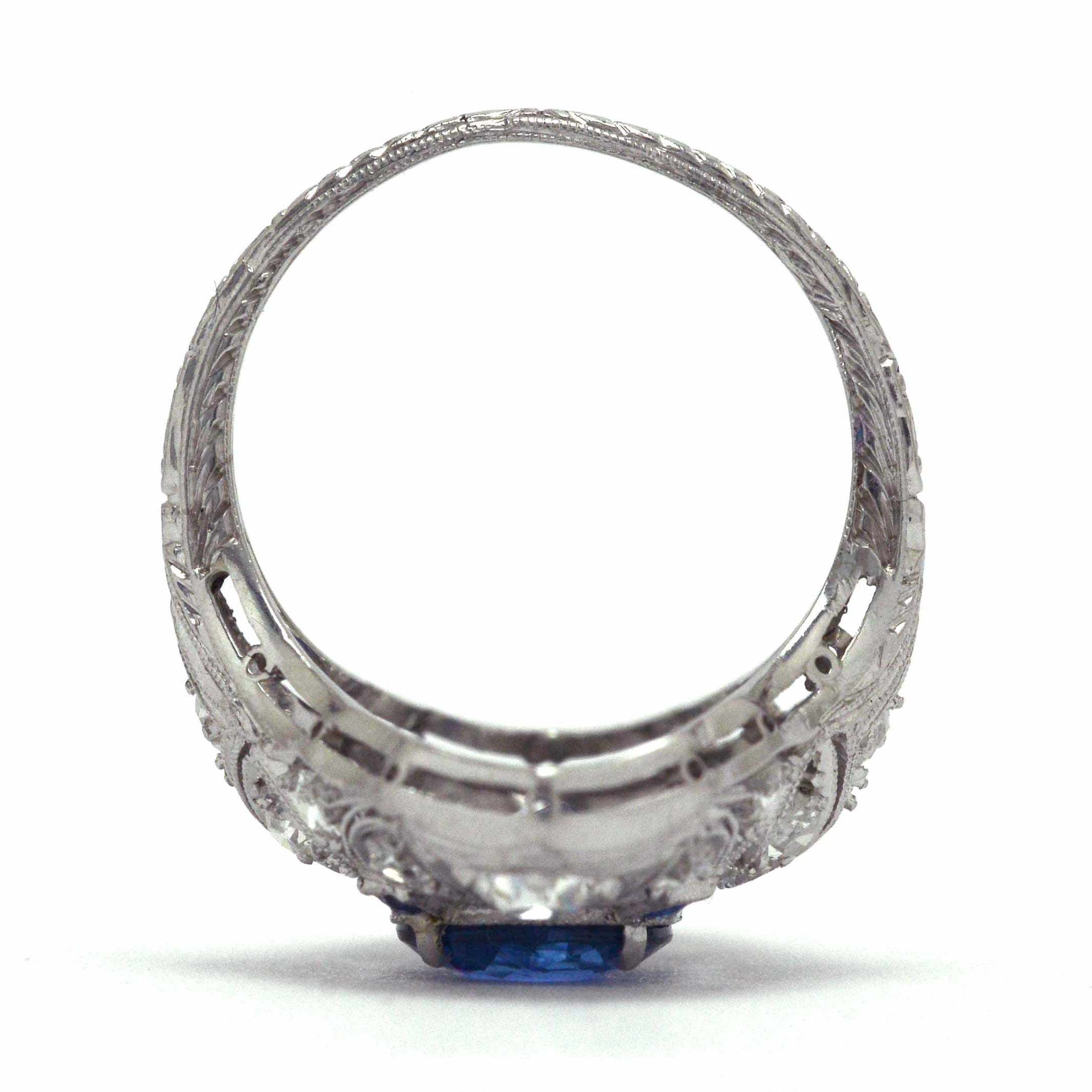 A Belle Epoque platinum filigree dinner ring with diamonds and sapphires.