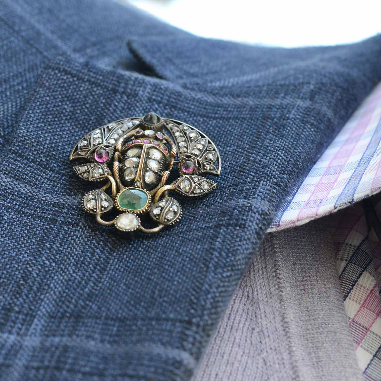 A well made antique scarab beetle with rare gems and diamonds.
