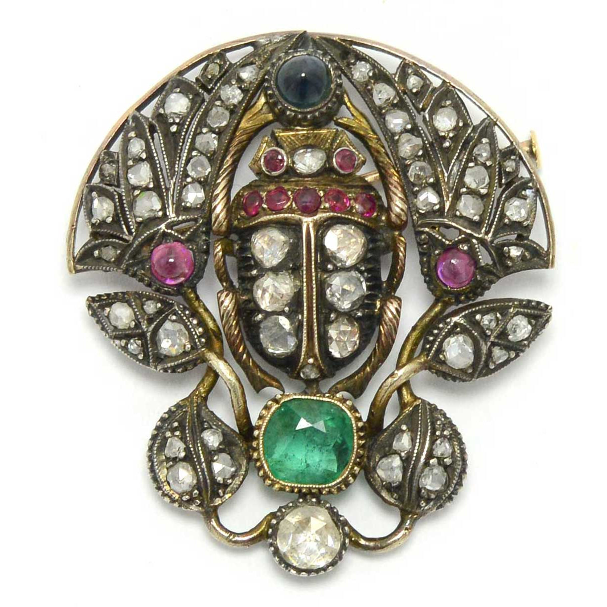 A late 1800s Victorian brooch with a variety of gemstones and diamonds.