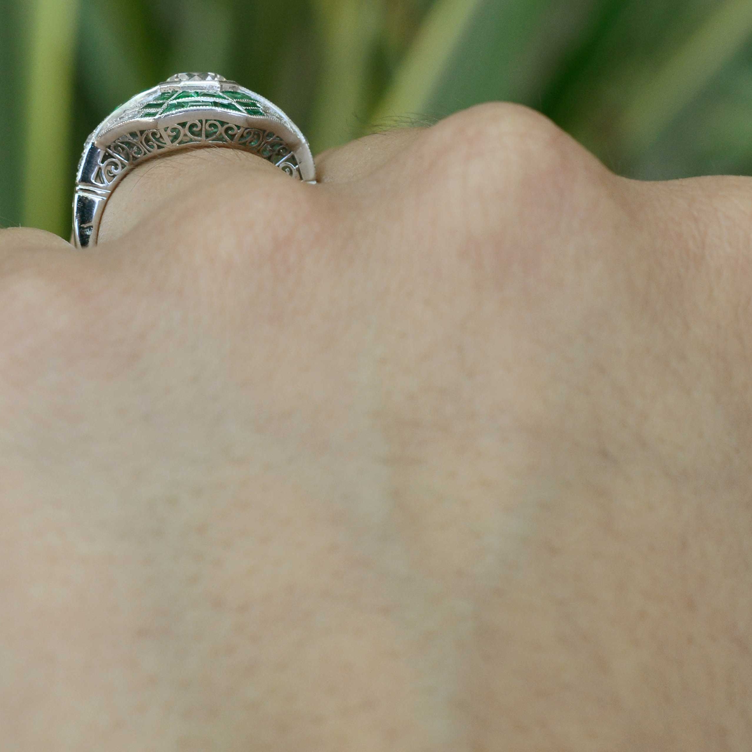 This platinum revival ring has a fancy filigree undergallery.