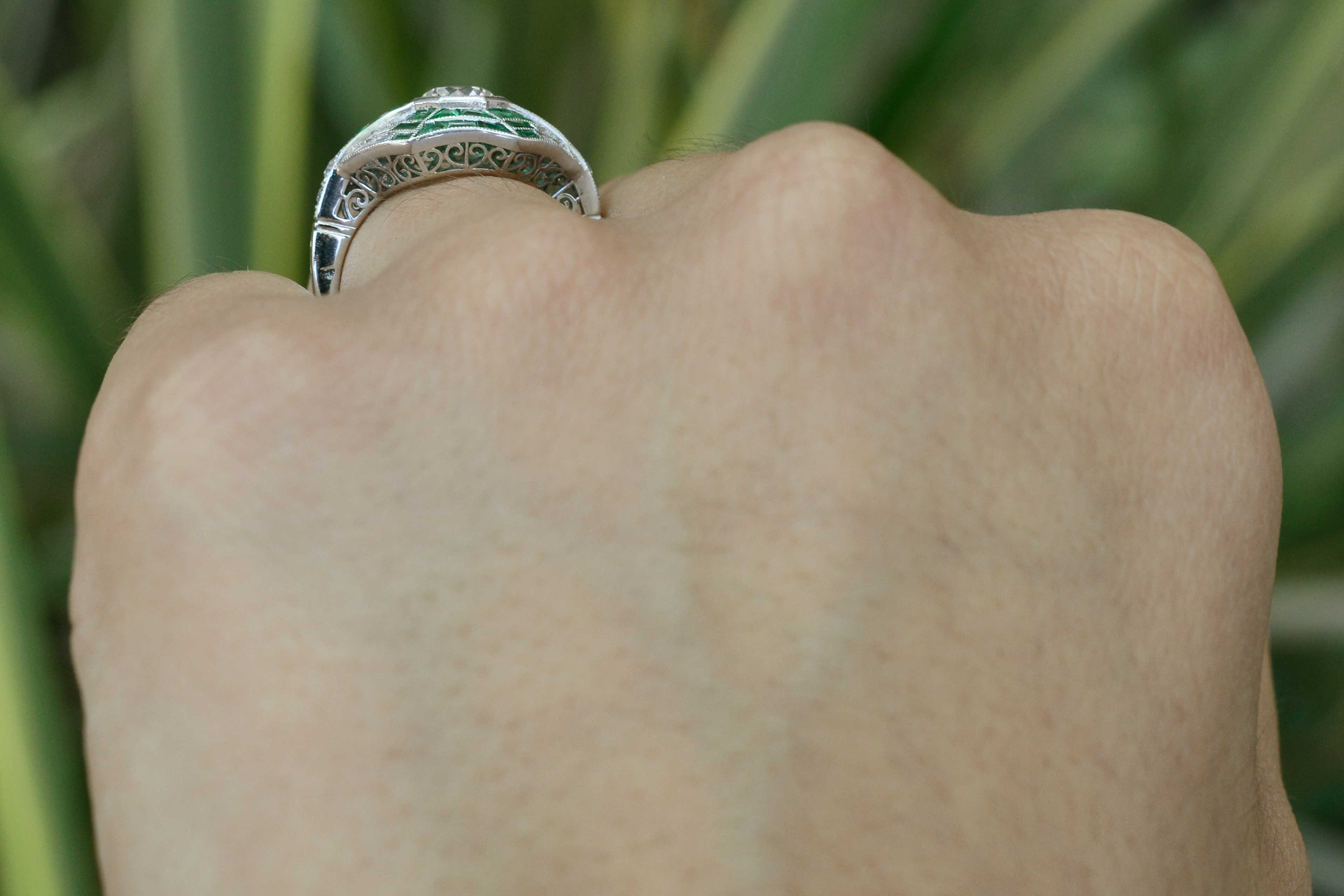 This platinum revival ring has a fancy filigree undergallery.