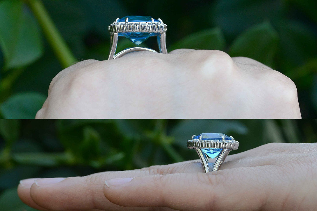 A new, tall antique square cushion blue topaz modern ring design.