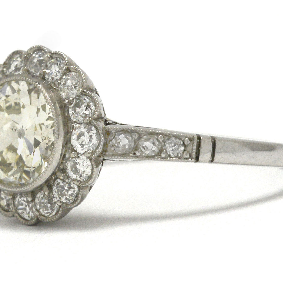 An over 1 carat old European diamond floral halo ring.