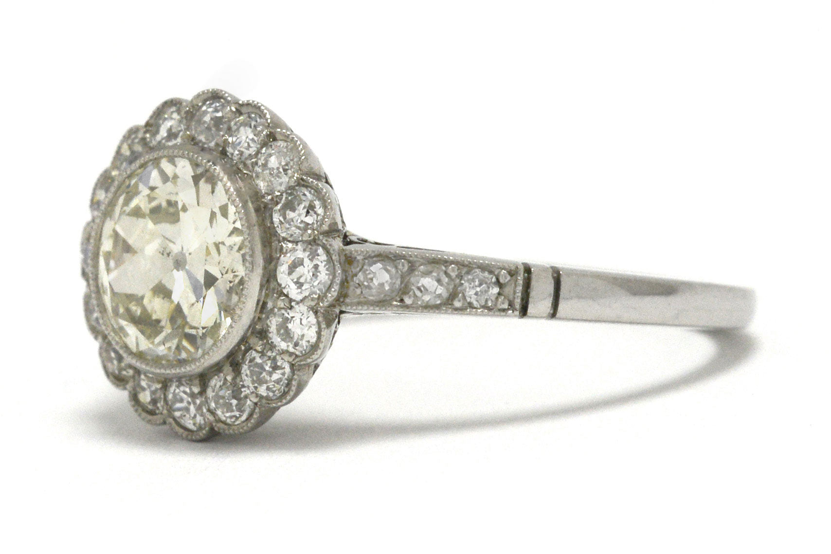 An over 1 carat old European diamond floral halo ring.