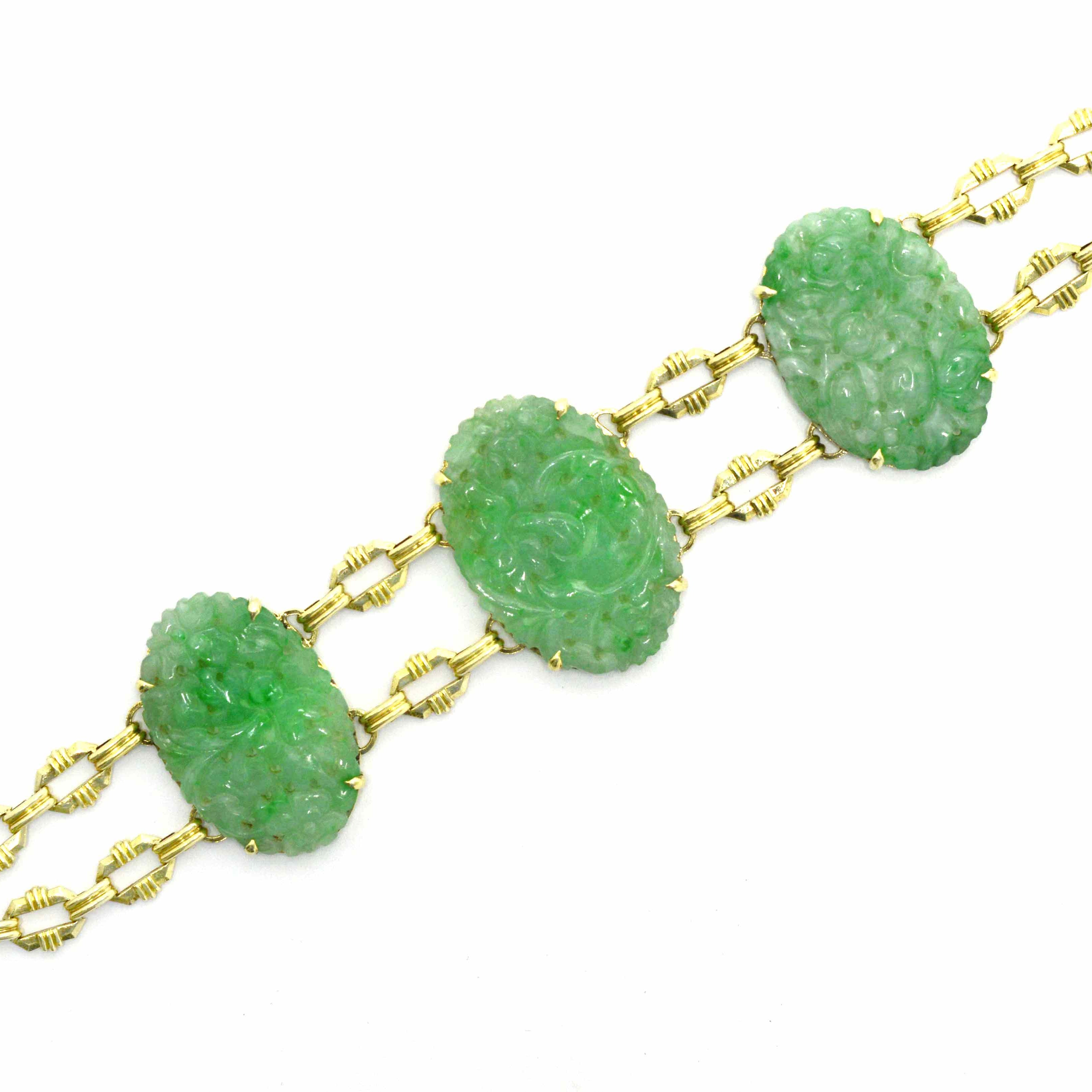 A floral motif, carved jadeite and 14k gold bracelet.