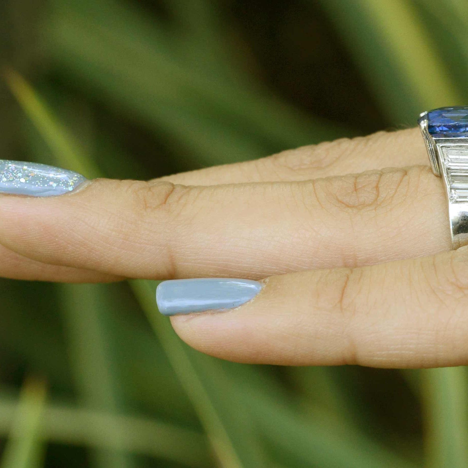 There are 6 diamonds on the band, 3 on each side of the shank.