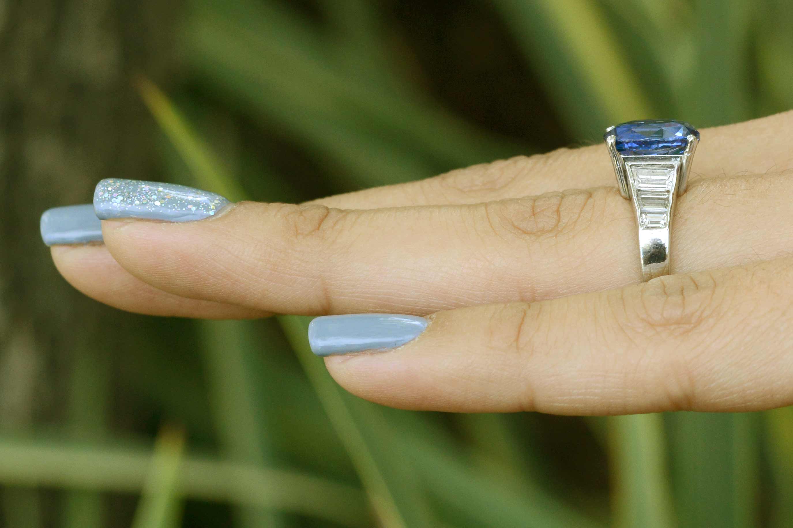 There are 6 diamonds on the band, 3 on each side of the shank.