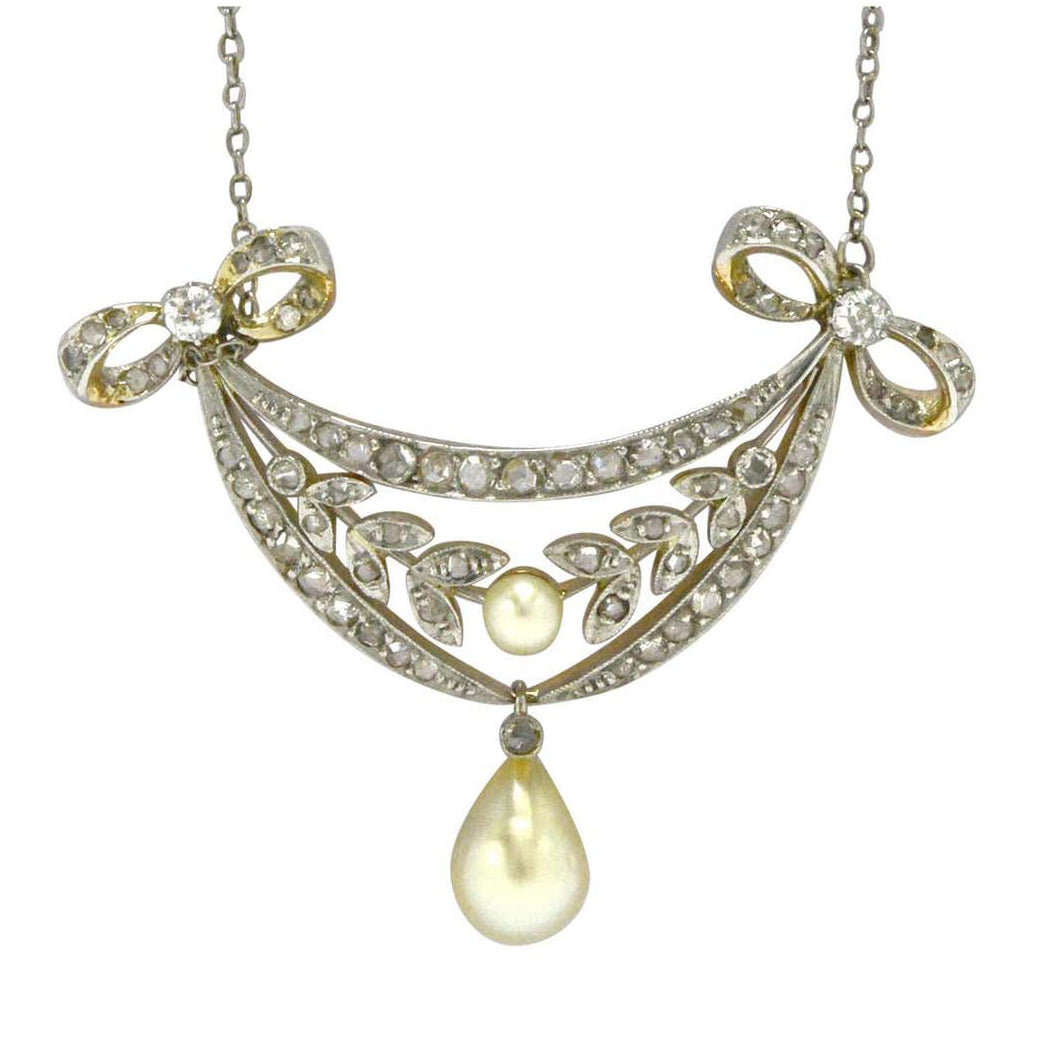 A 1910, Art Nouveau pearl and diamonds bow necklace.