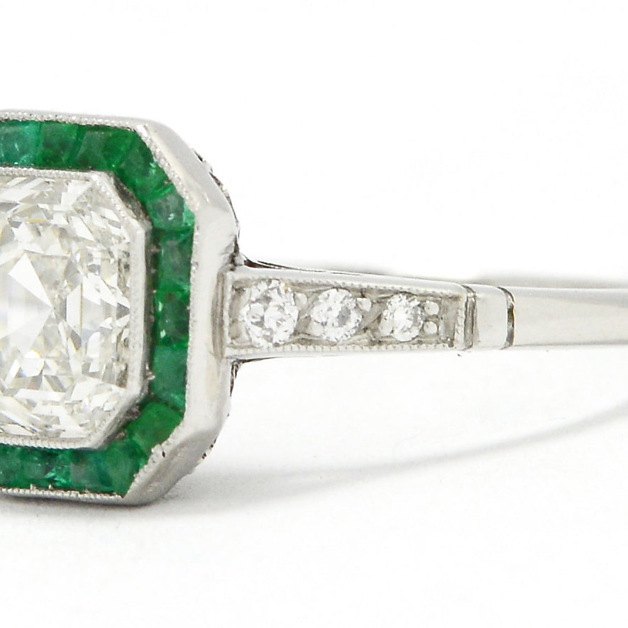 There are three diamonds on the shank of this Art Deco revival wedding ring.