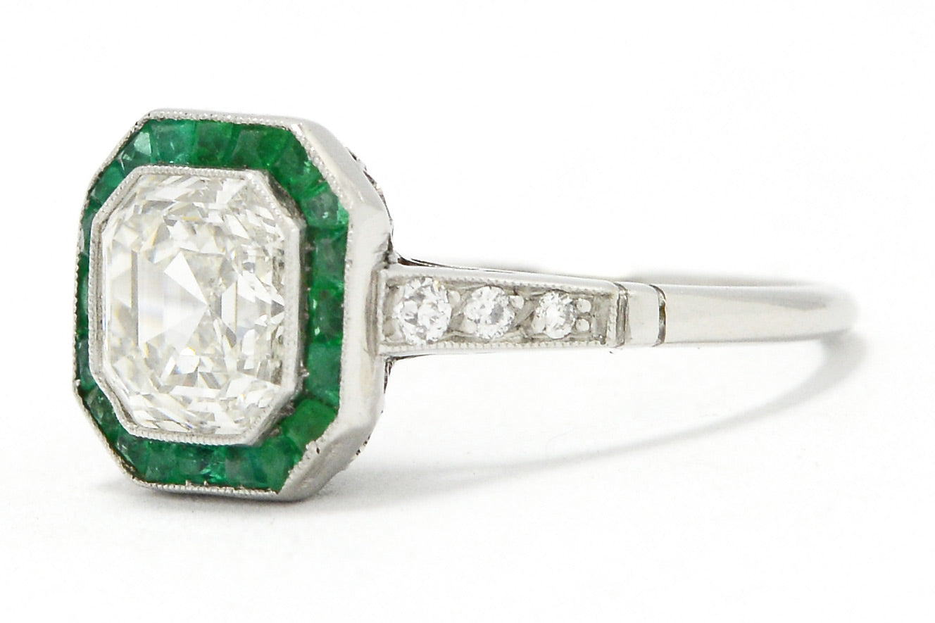 There are three diamonds on the shank of this Art Deco revival wedding ring.