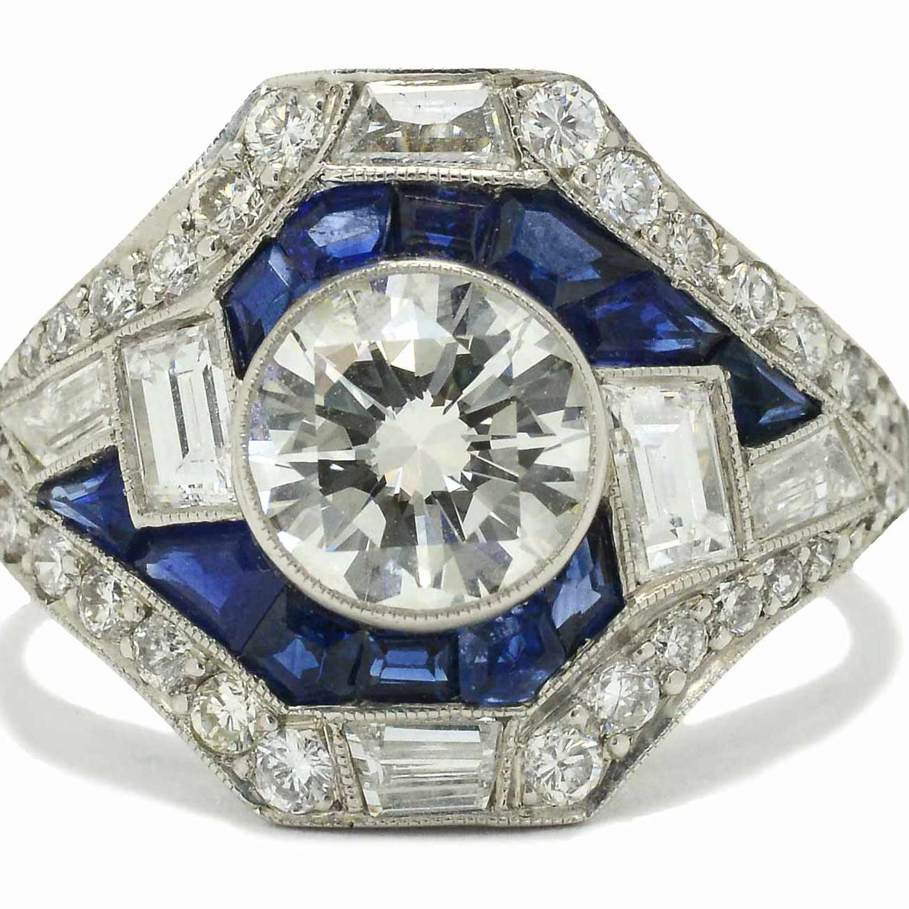 The Carlisle Hall is an astounding, asymmetrical Art Deco inspired diamond engagement ring.