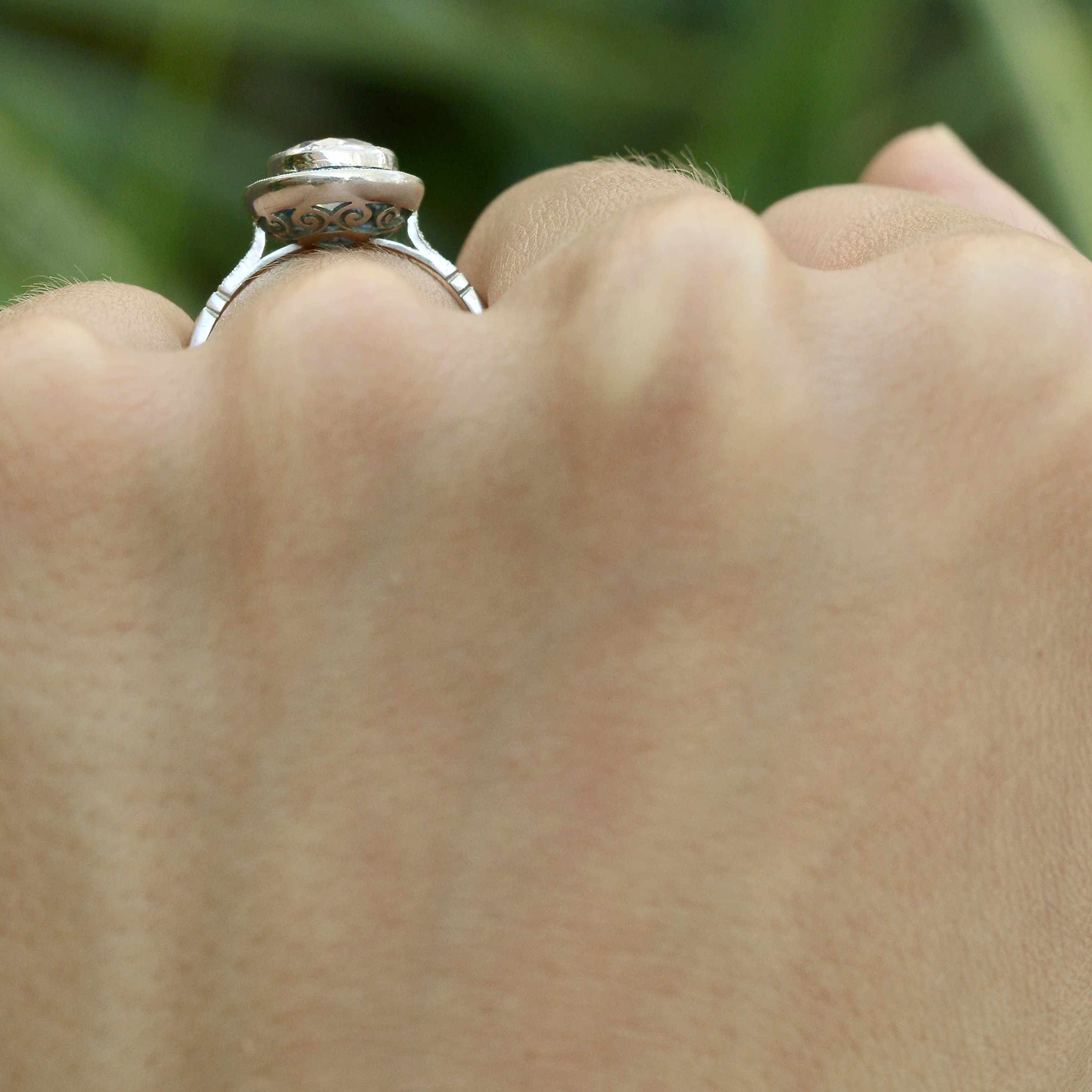 A 1.50 carat center diamond in a sapphire halo wedding ring.