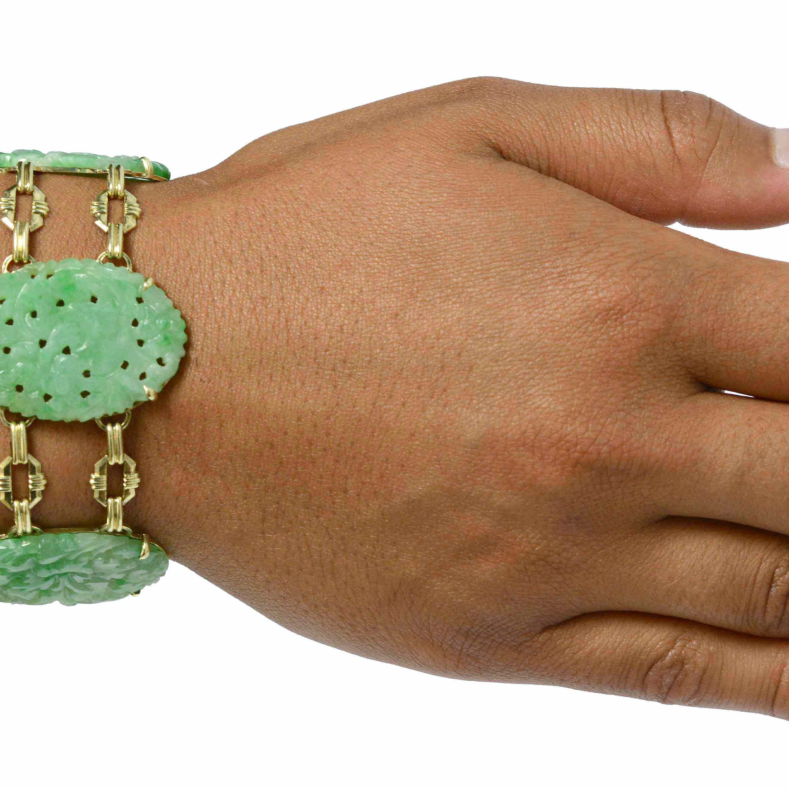 Wide oval carved jadeite Art Deco bracelet.