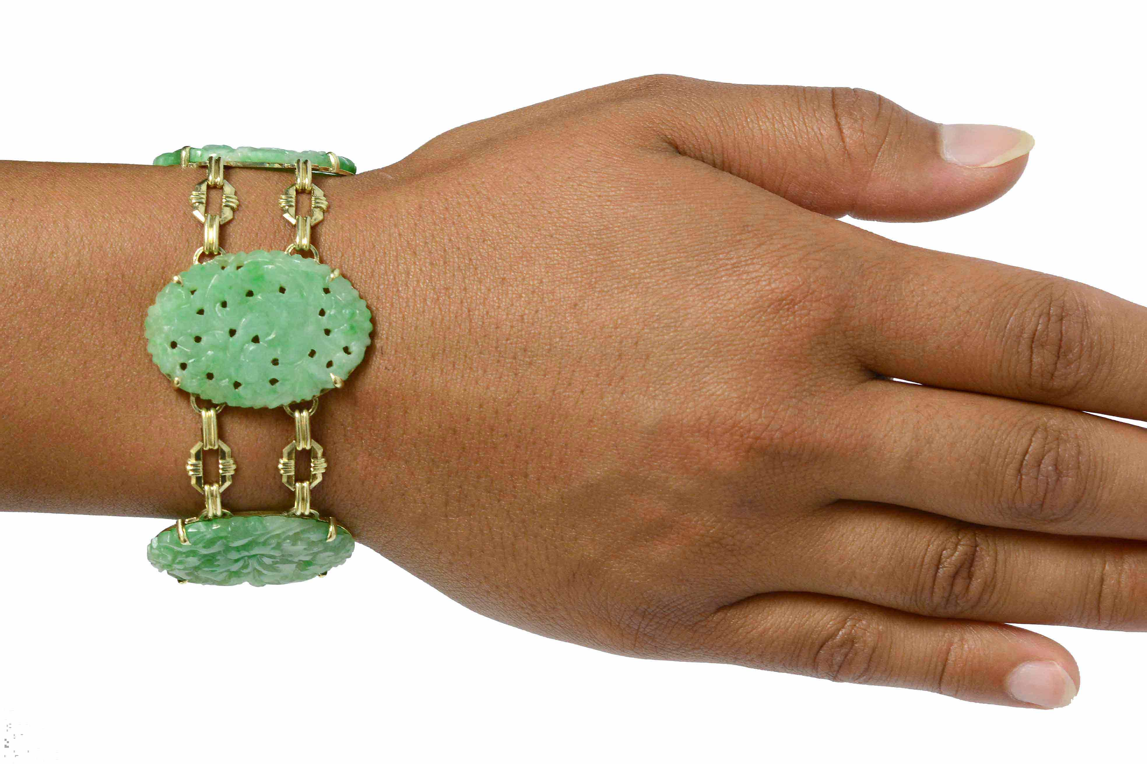 Wide oval carved jadeite Art Deco bracelet.