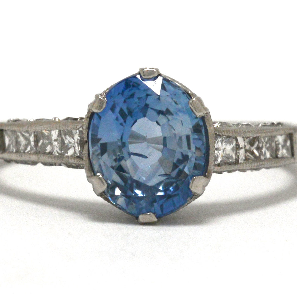 Art Deco inspired ceylon sapphire solitaire engagement ring with diamonds.