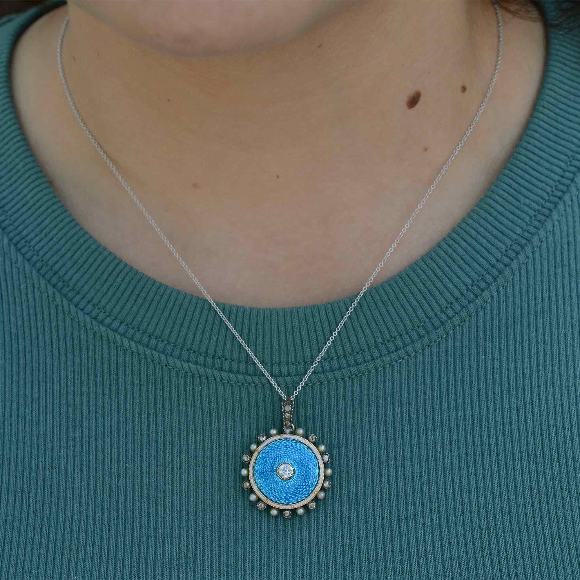 old mine brilliant diamonds and natural pearls line this 14k white gold necklace.