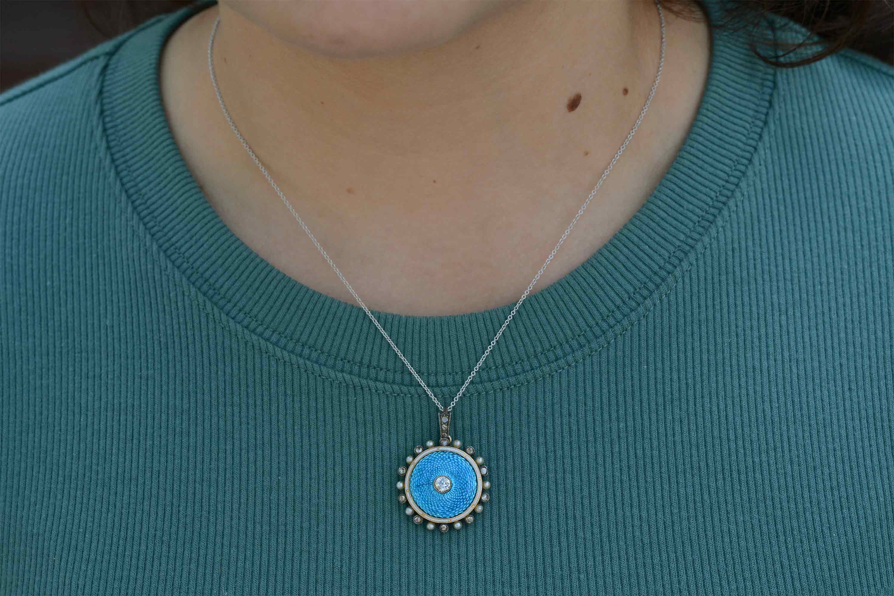 old mine brilliant diamonds and natural pearls line this 14k white gold necklace.