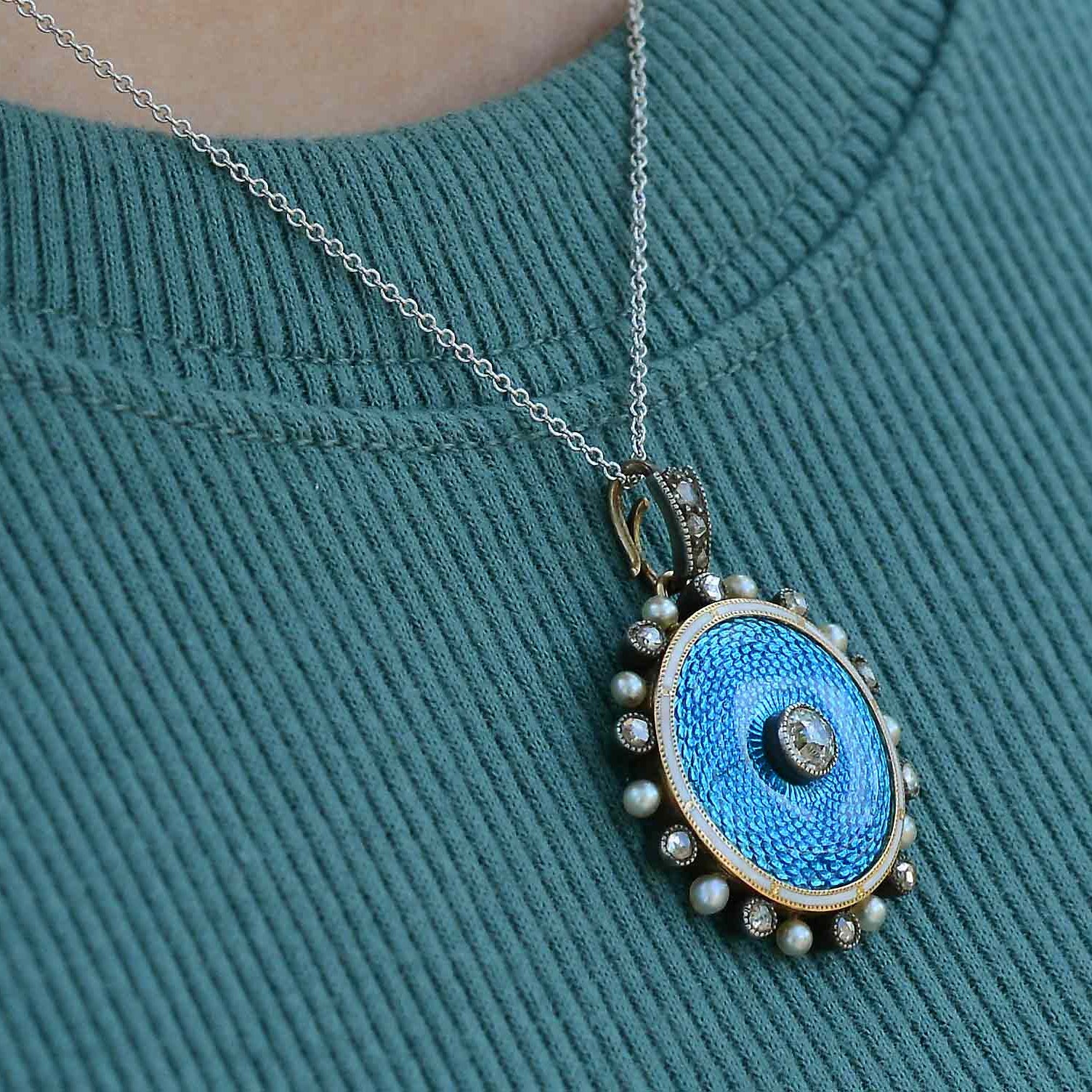 This turquoise blue diamond and pearl necklace is 18" long.