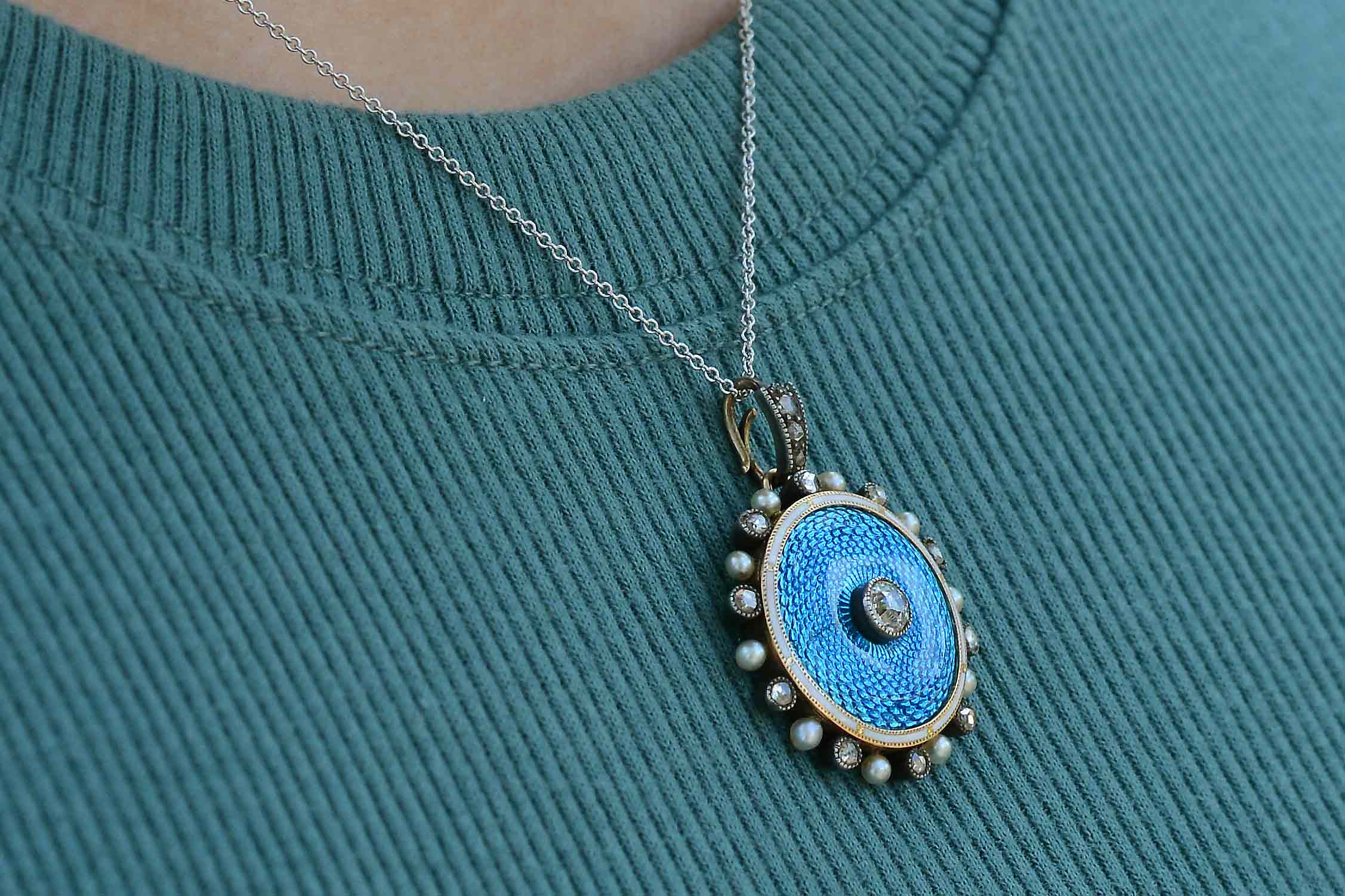 This turquoise blue diamond and pearl necklace is 18" long.