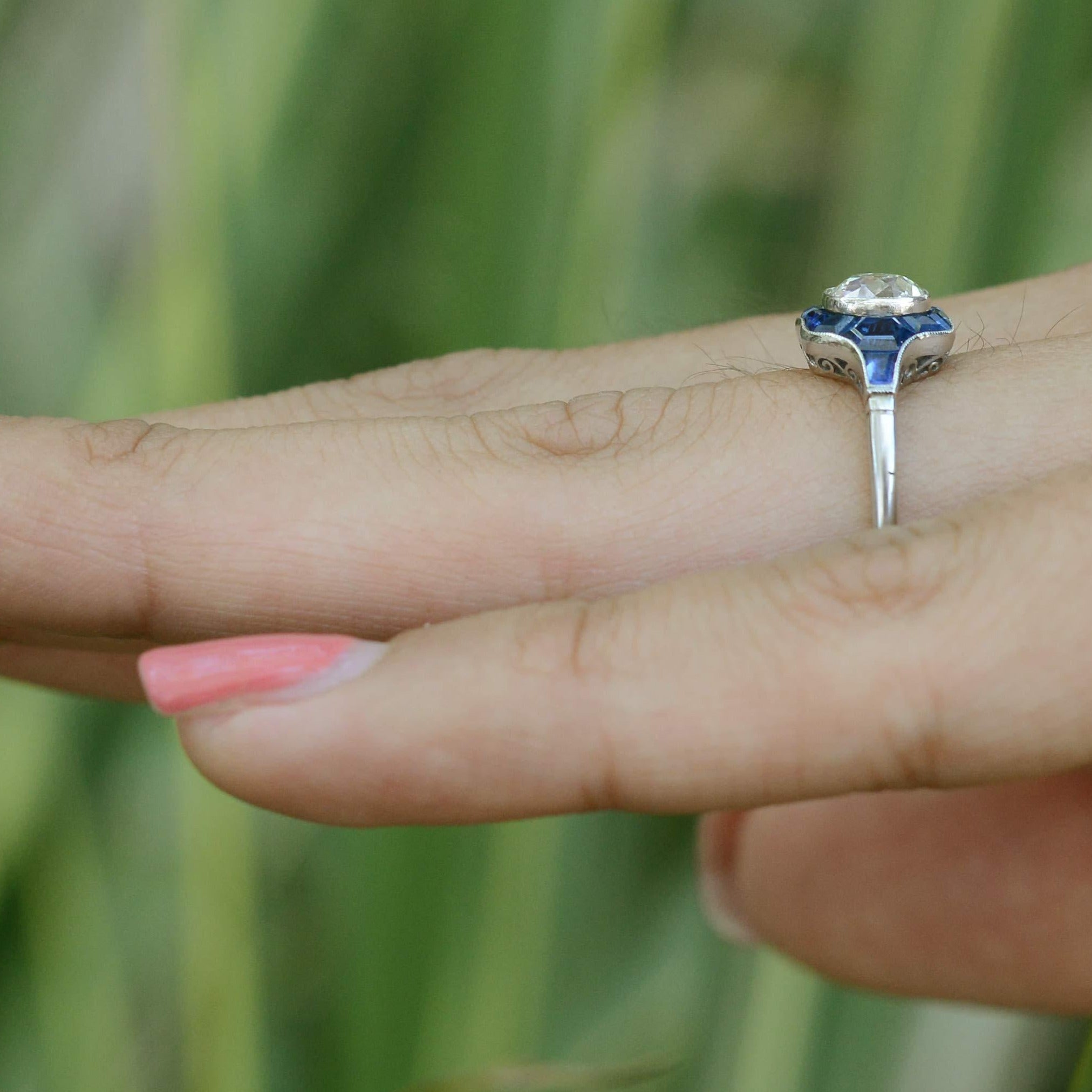Blue sapphires accent this unique diamond wedding ring.