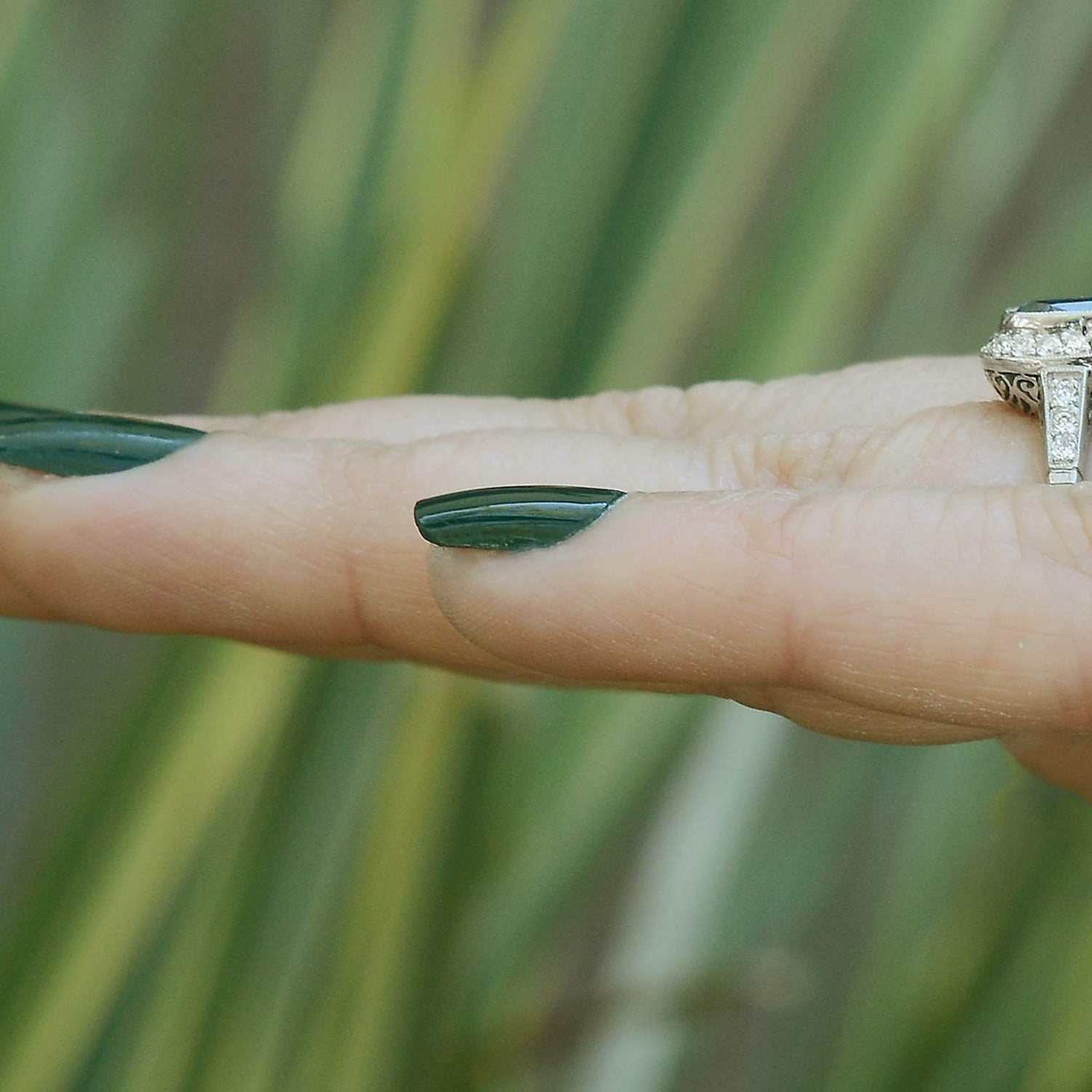 A size 7, 3 carat antique cushion blue sapphire engagement ring.