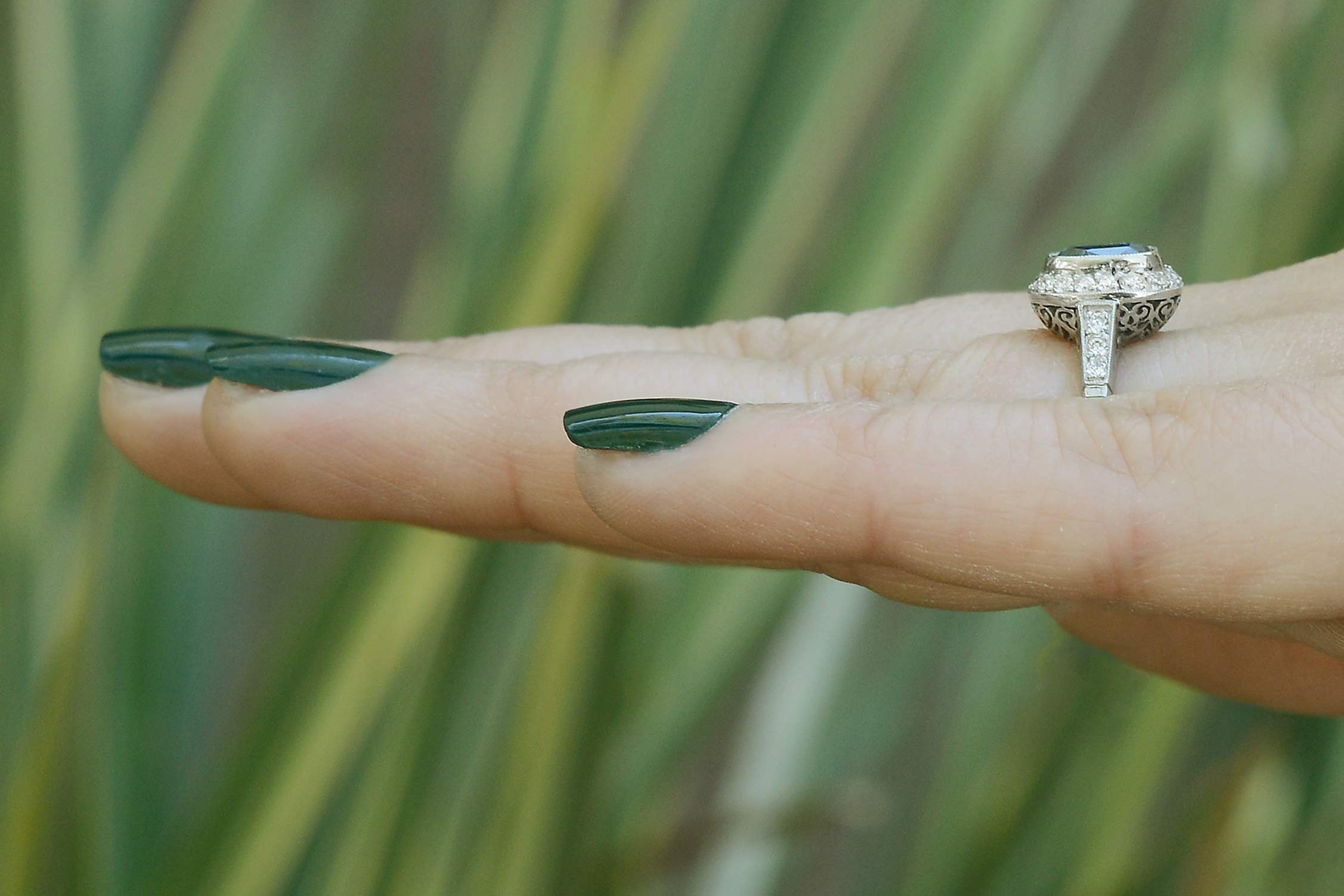 A size 7, 3 carat antique cushion blue sapphire engagement ring.