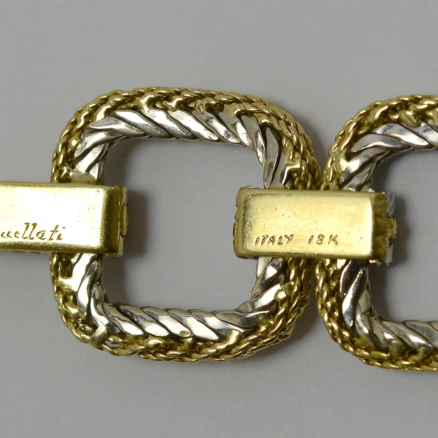 A buccellati Italy 18k hallmark engraved on a gold bracelet.
