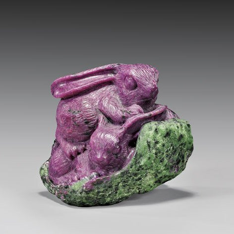 2 bunnies carved out of a rich apple green zoisite gemstone.