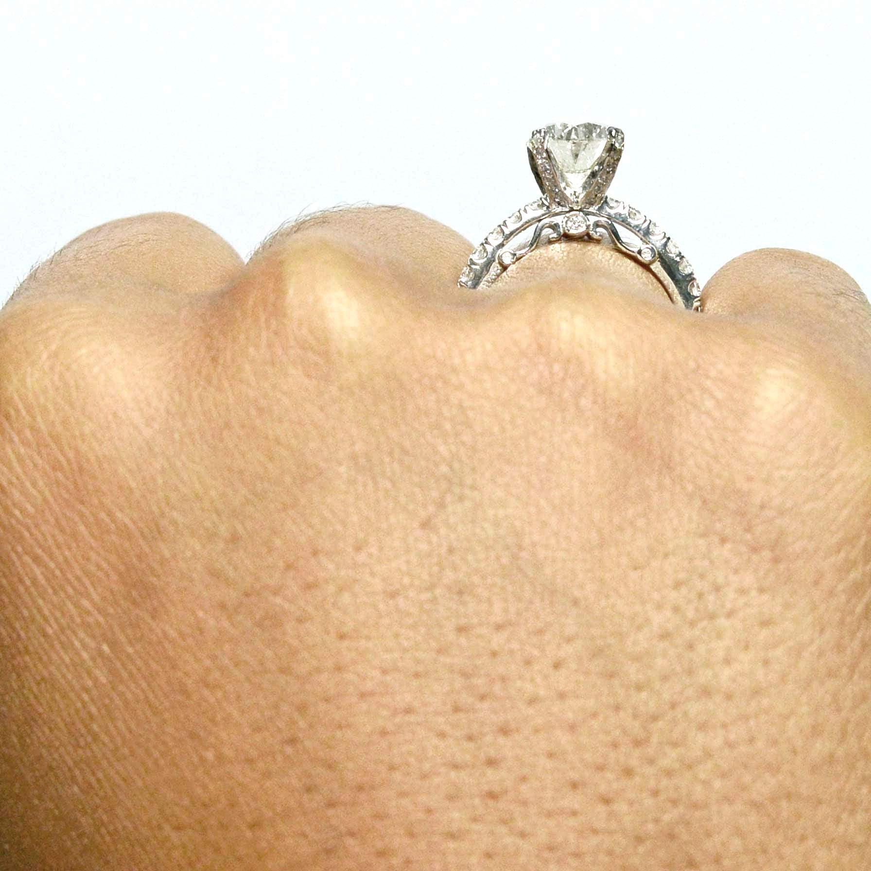 A tall set diamond solitaire ring.