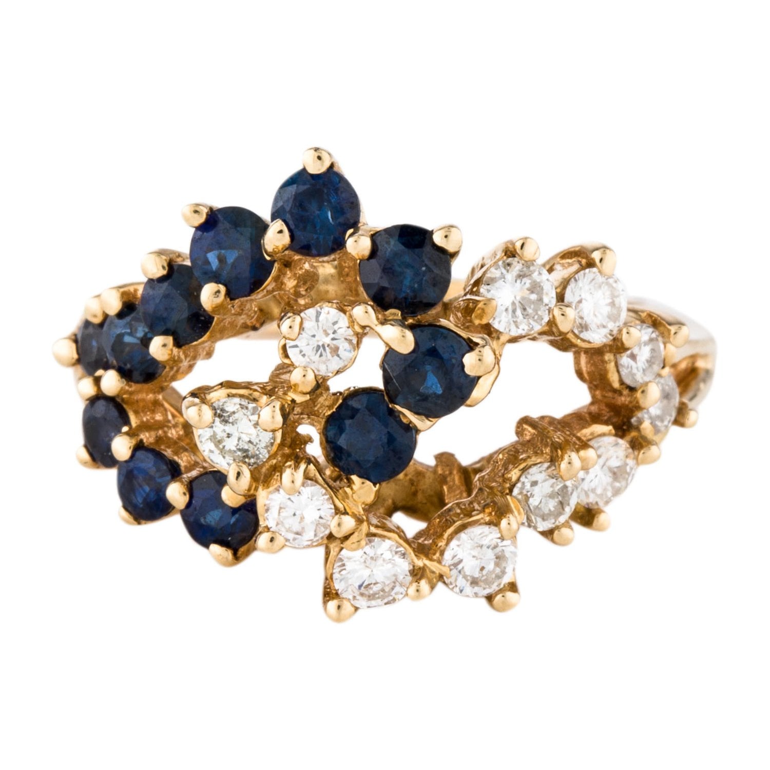 Diamond and blue sapphire gold cluster cocktail ring.