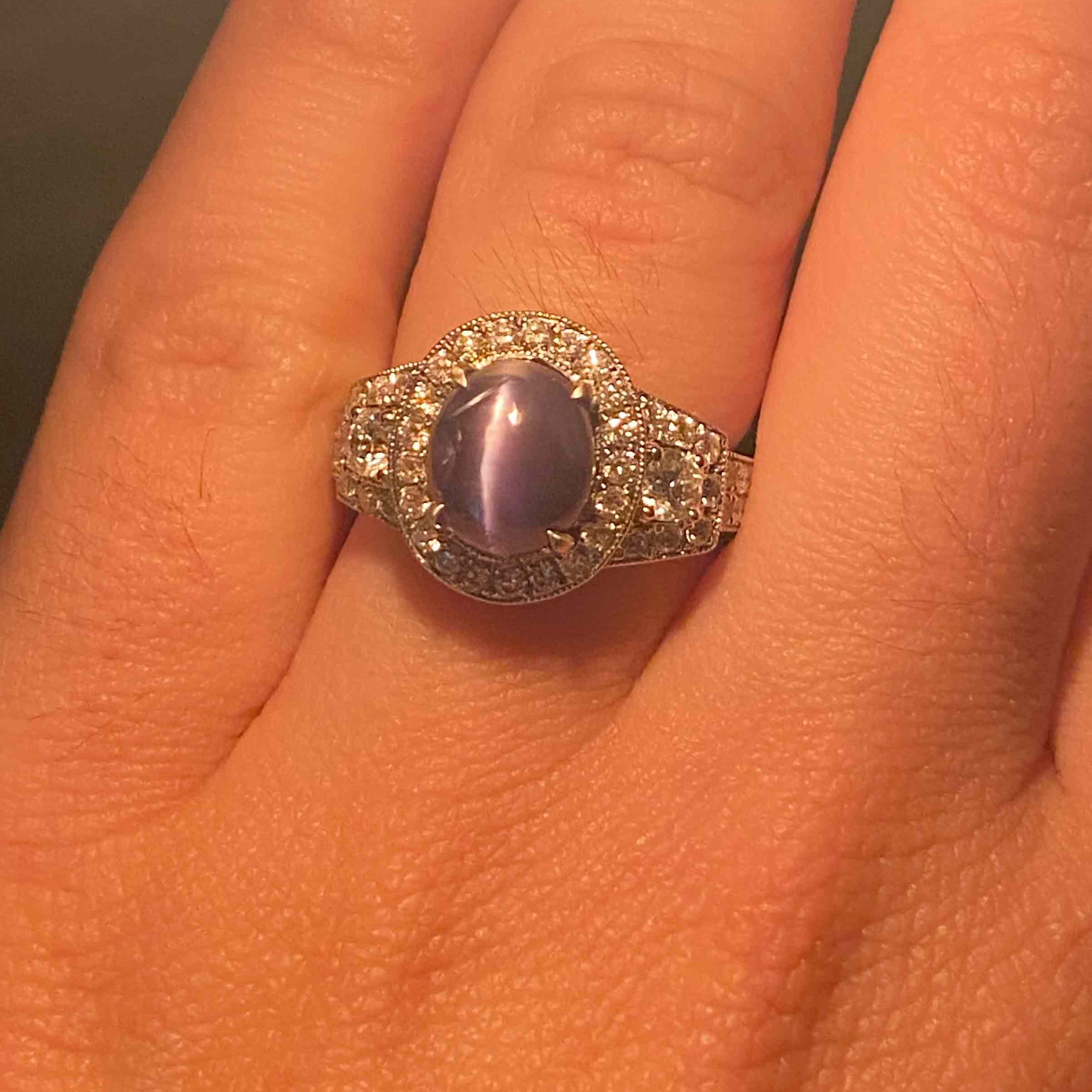 Under incandescent lighting this oval cabochon alexandrite looks gray-purple.