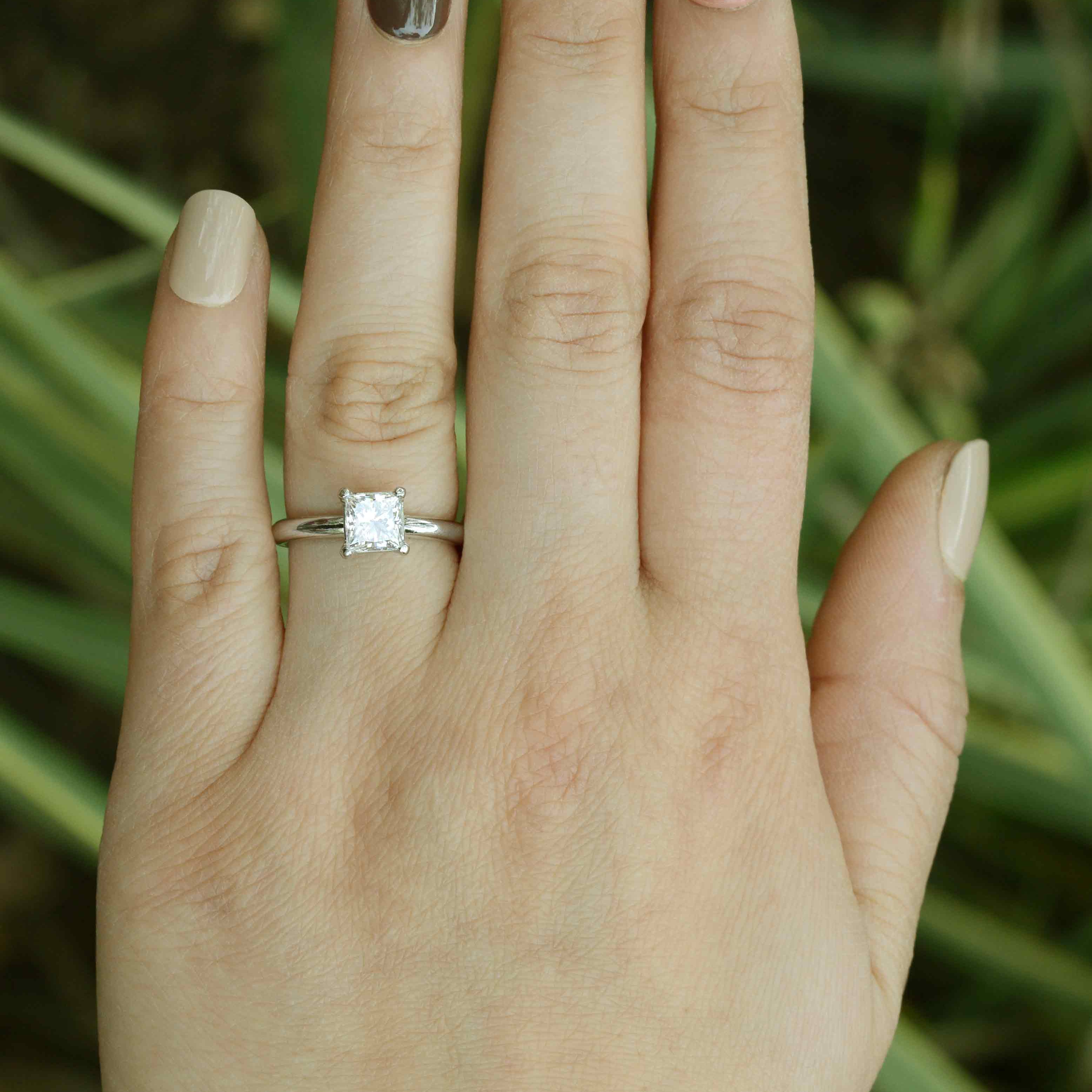 This GIA cerified princess diamond measures over 1 carat, set in a single stone solitaire mounting.