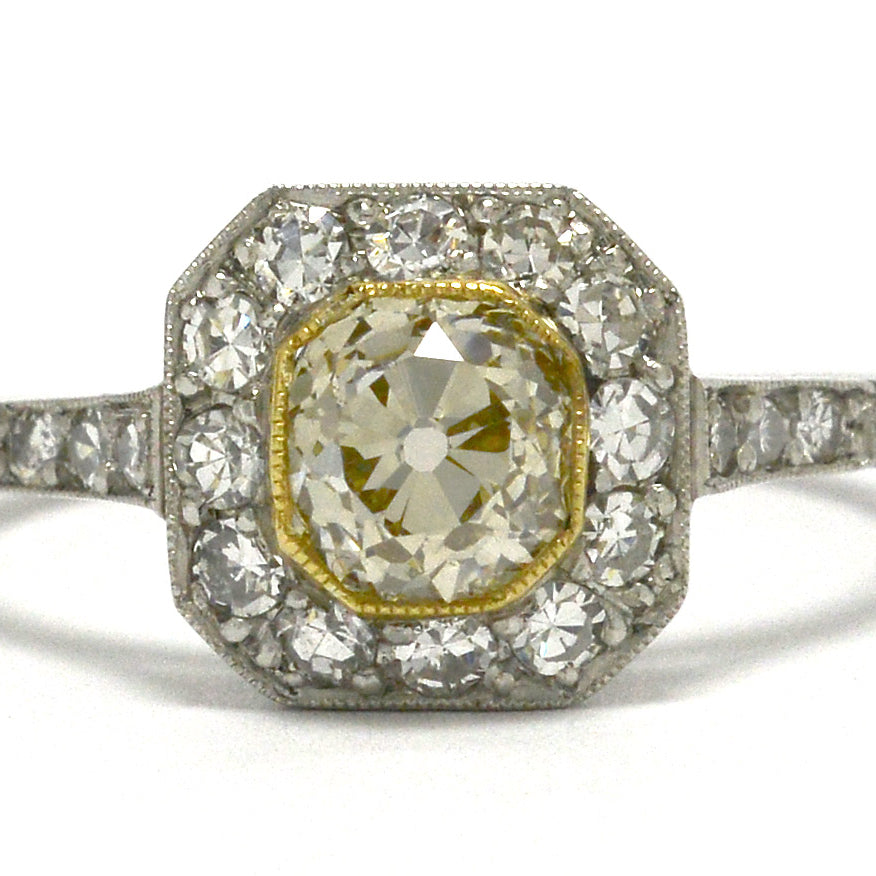 Light yellow old mine diamond engagement ring.