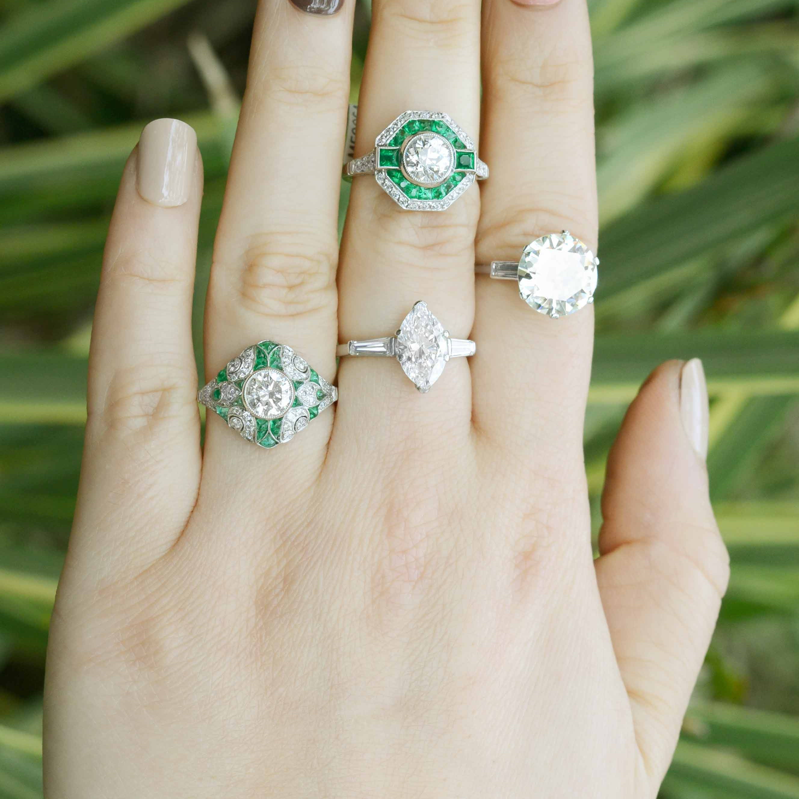 Diamonds and emeralds wedding rings.