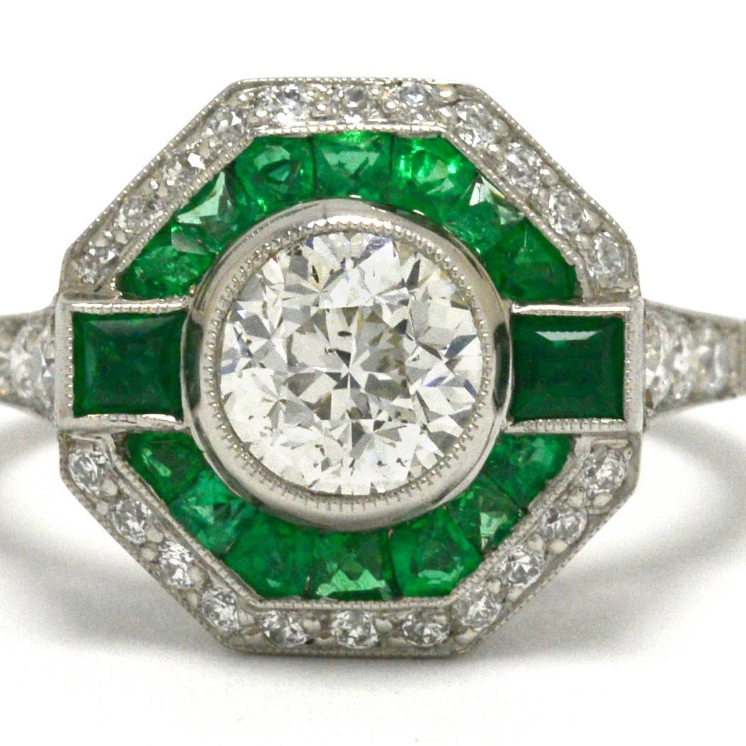 A unique octagon Art Deco diamond engagement ring with an emerald halo.