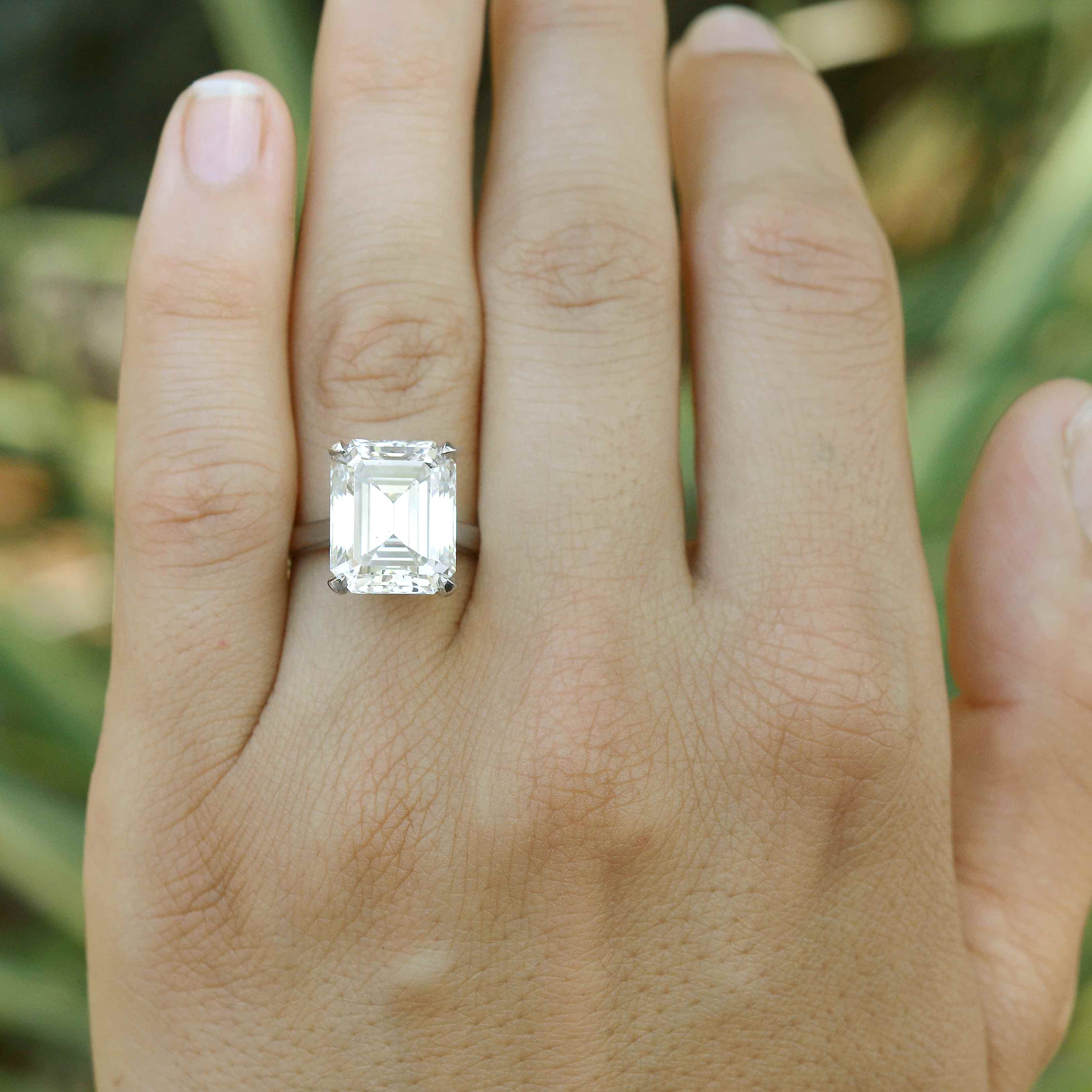 A giant emerald cut diamond set in a 4 prong soltaire setting.