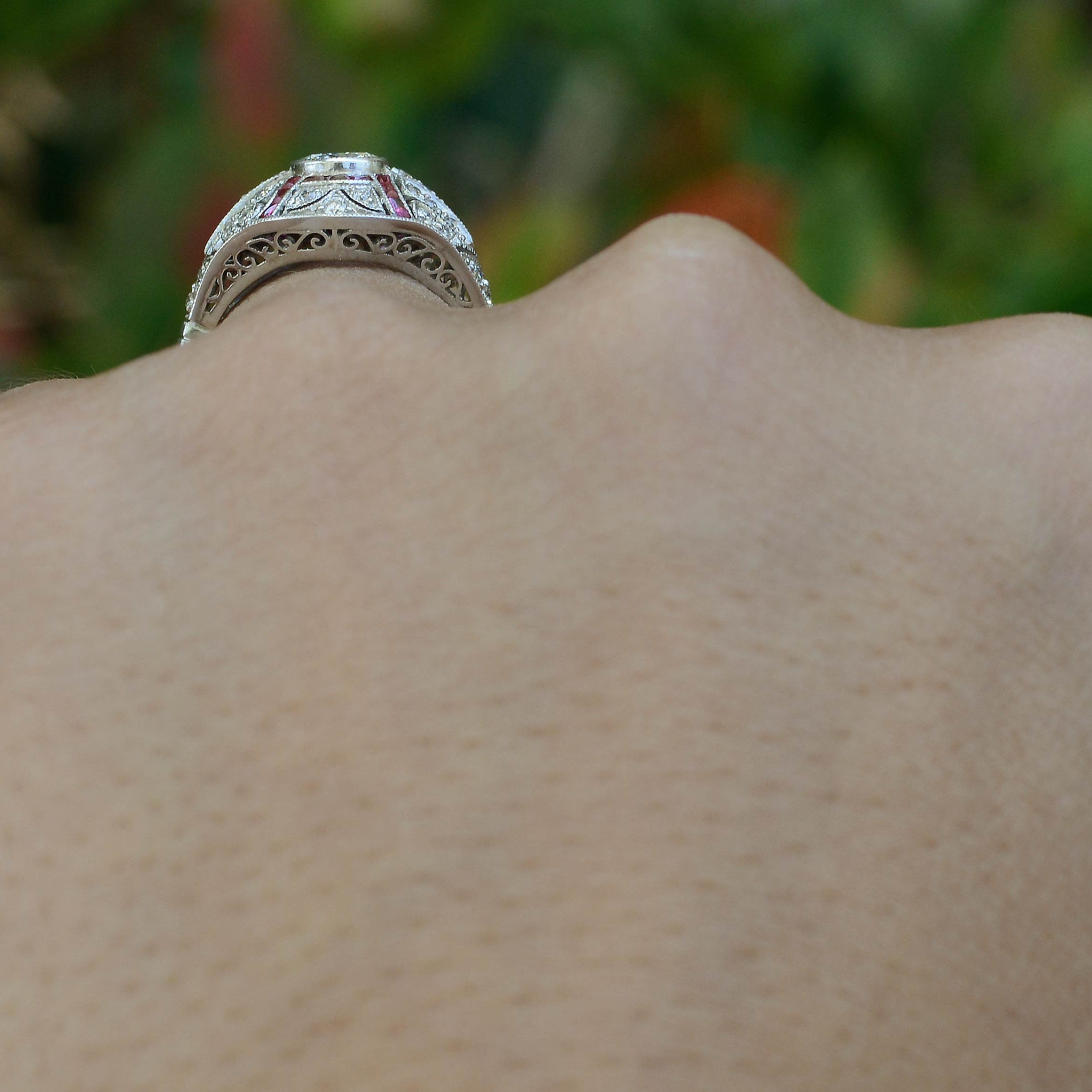 An Edwardian revival diamond and ruby dome ring.
