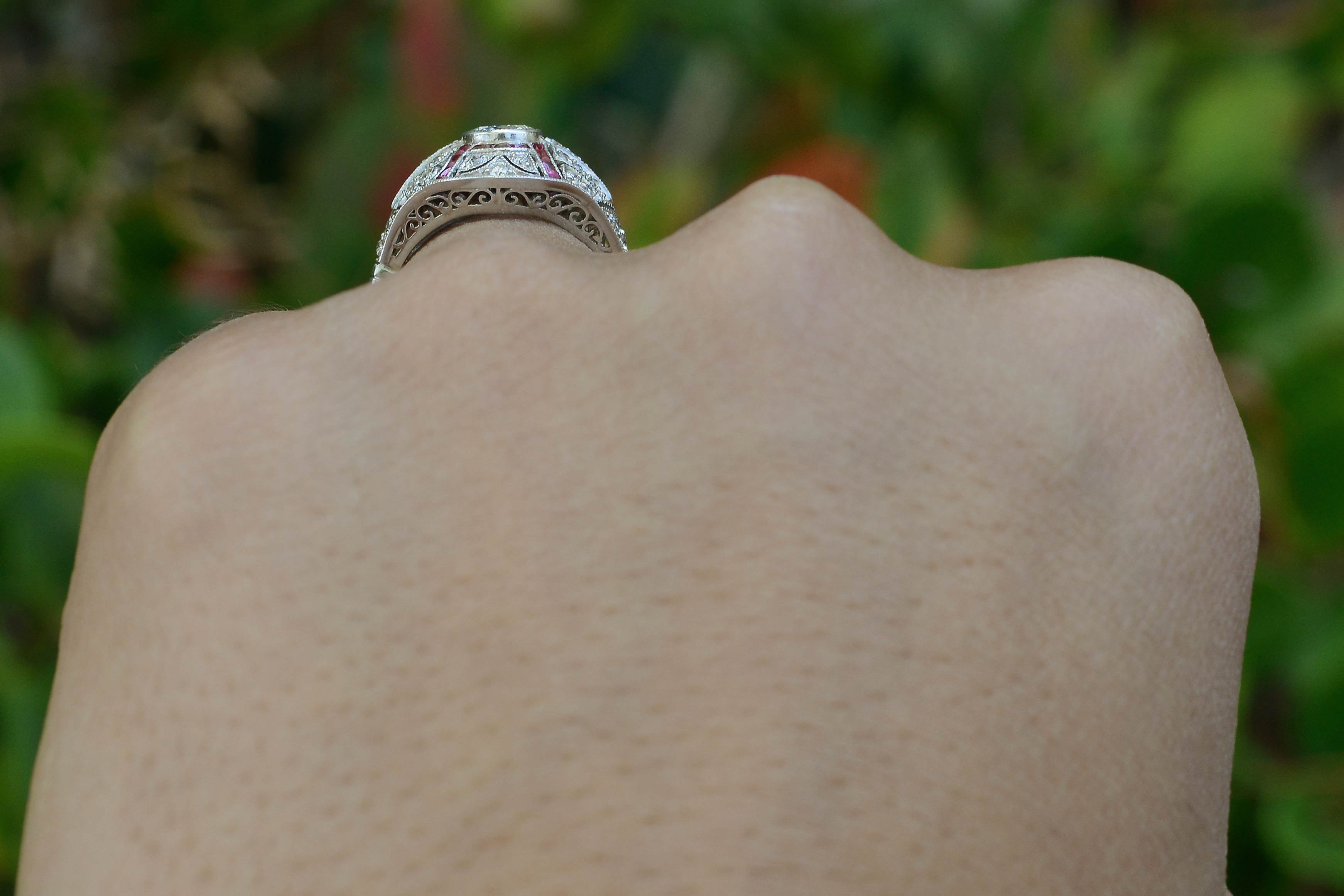 An Edwardian revival diamond and ruby dome ring.