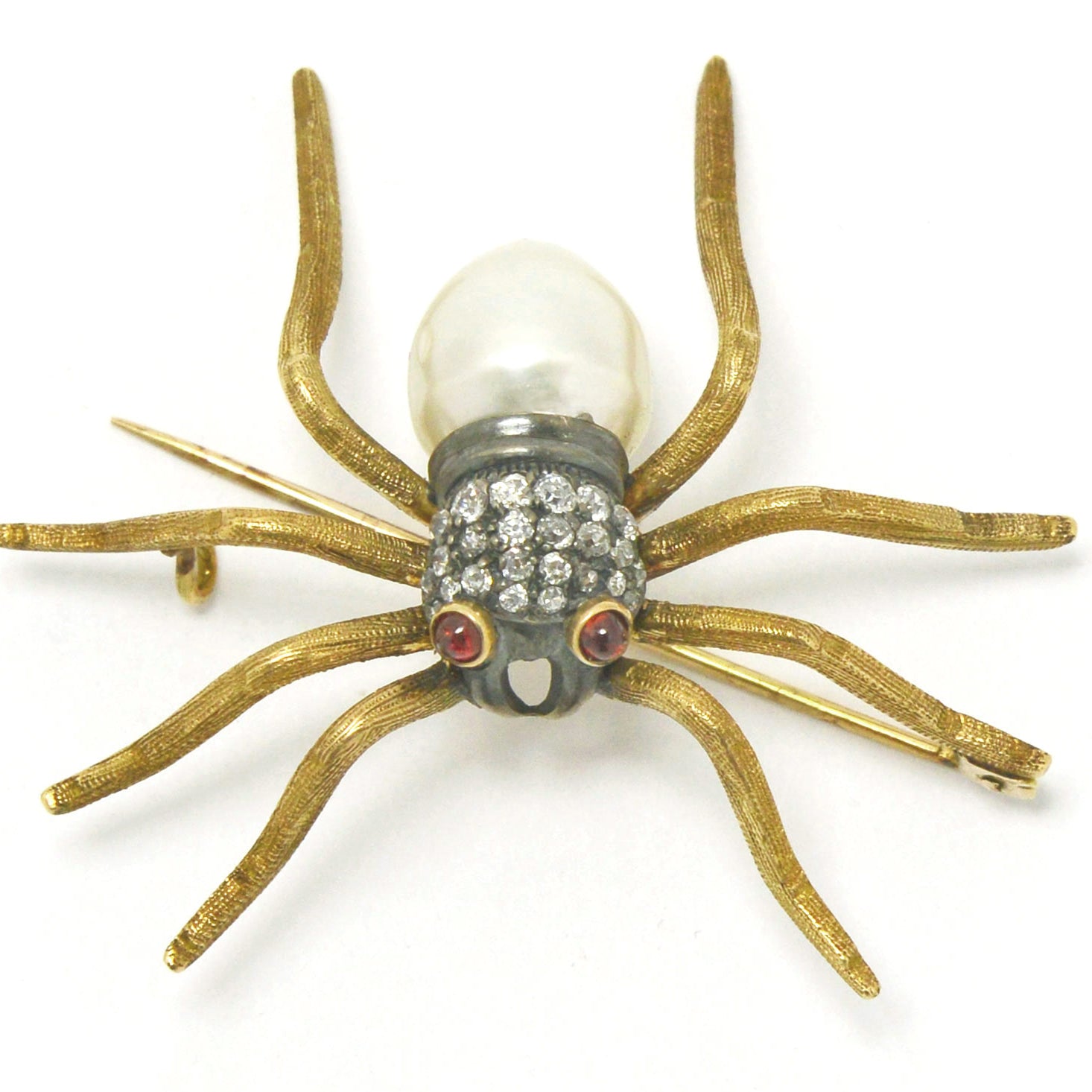 A late 1800s diamond and pearl spider brooch.