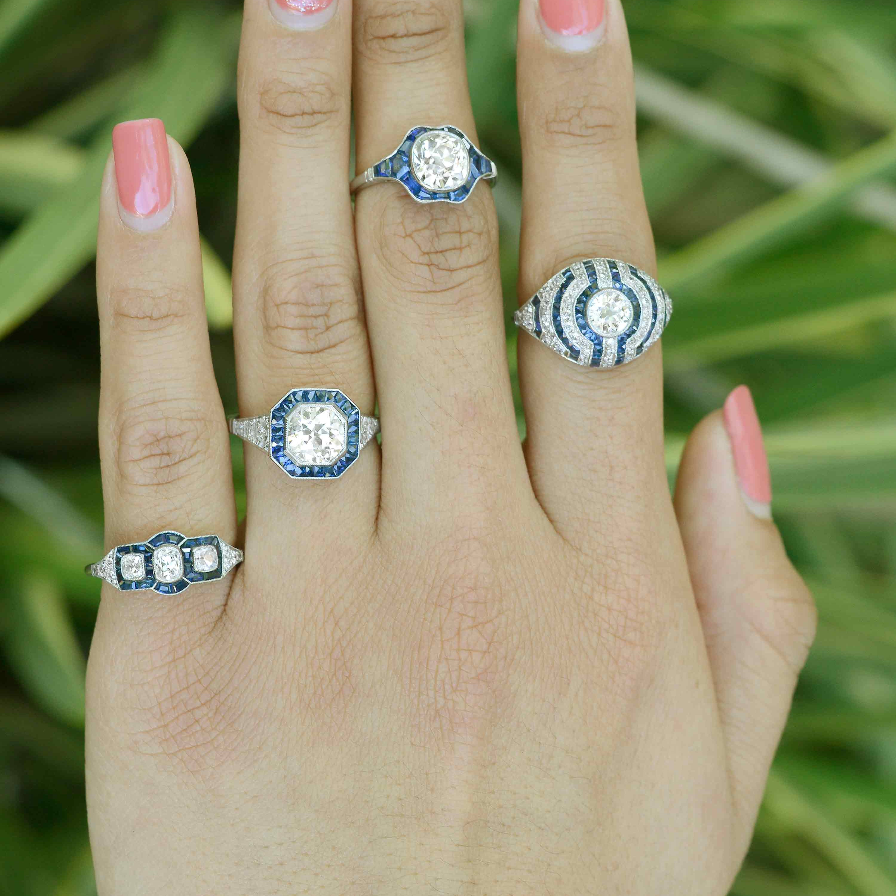 Art Deco style engagment rings with diamonds and blue sapphires.