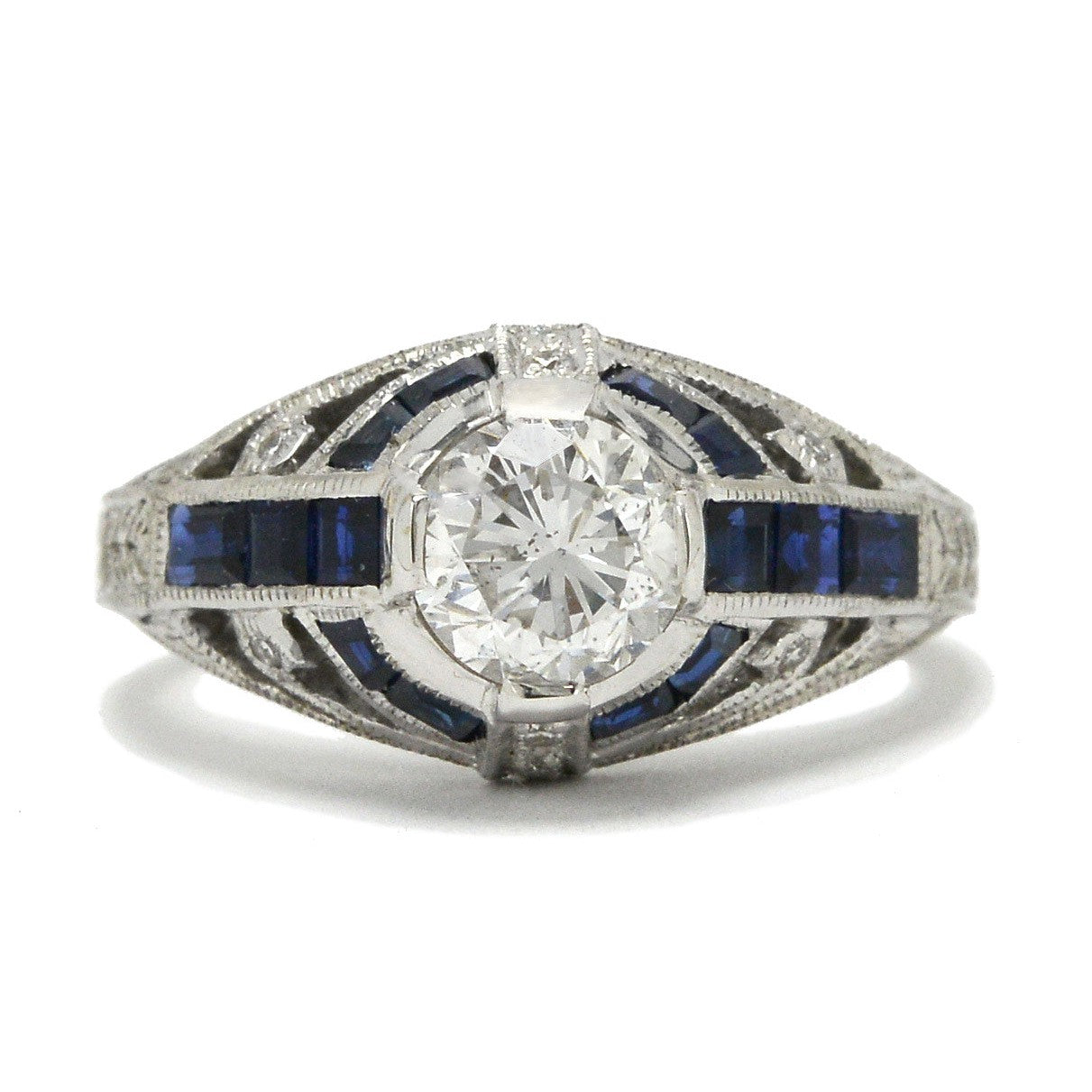 A unique diamond engagement ring with blue sapphire stripes.