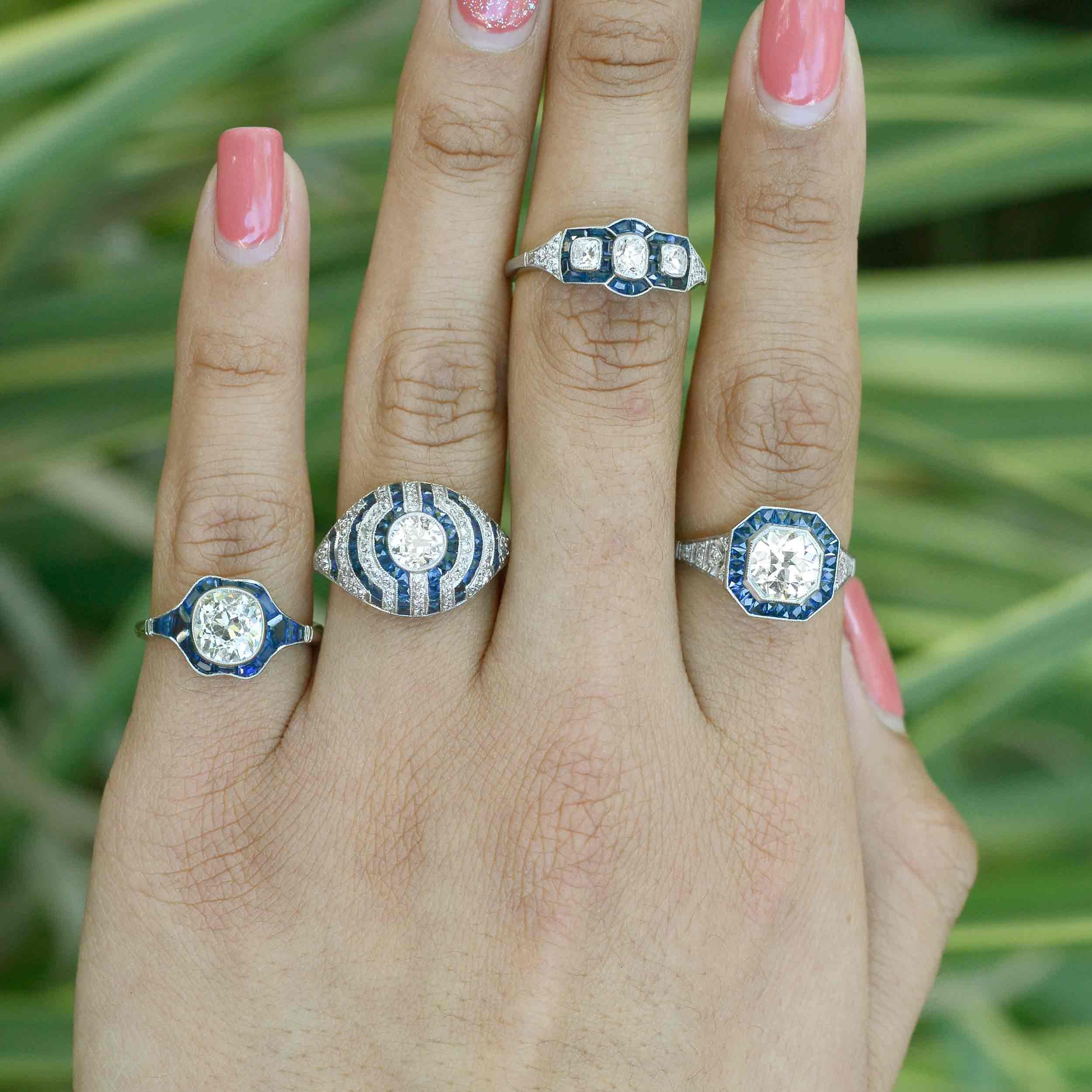 Diamond and blue sapphire target design engagement rings.