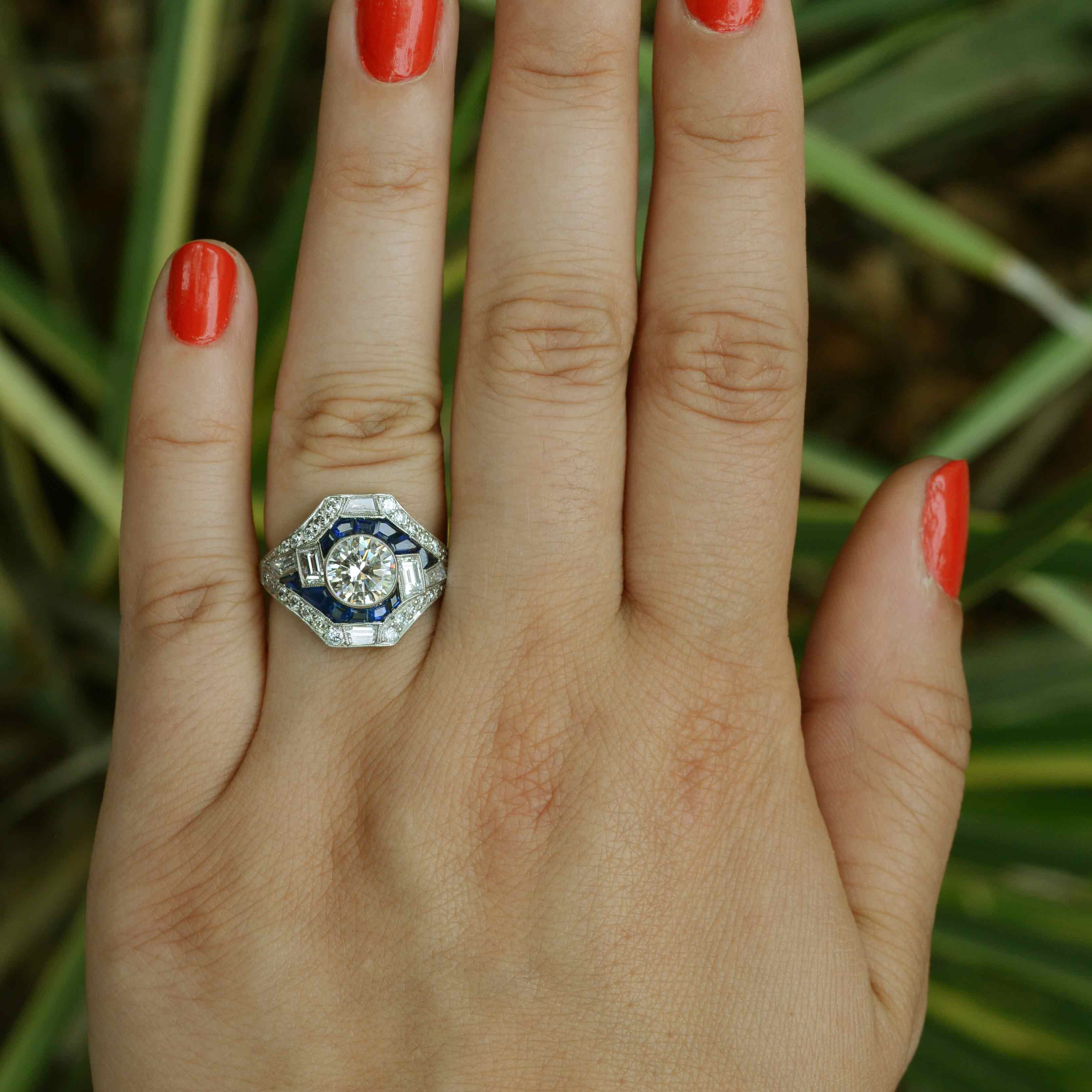 This unique geometric engagement ring design is based off Art Deco style jewelry.