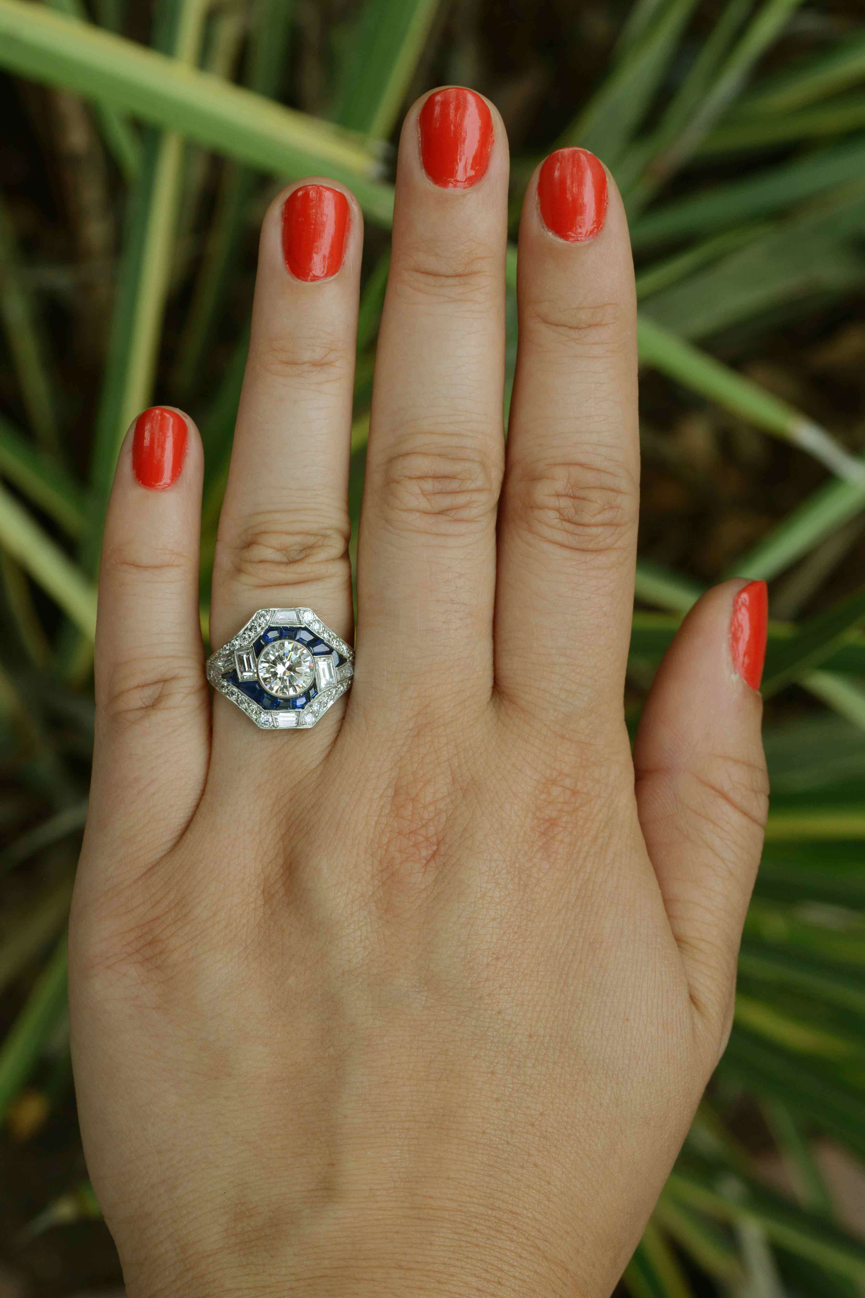 This unique geometric engagement ring design is based off Art Deco style jewelry.