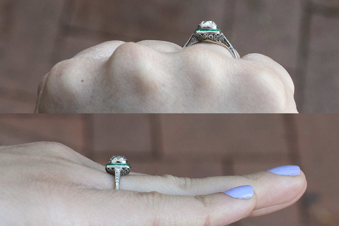 The cushion diamond has a little dome on top of this ring.